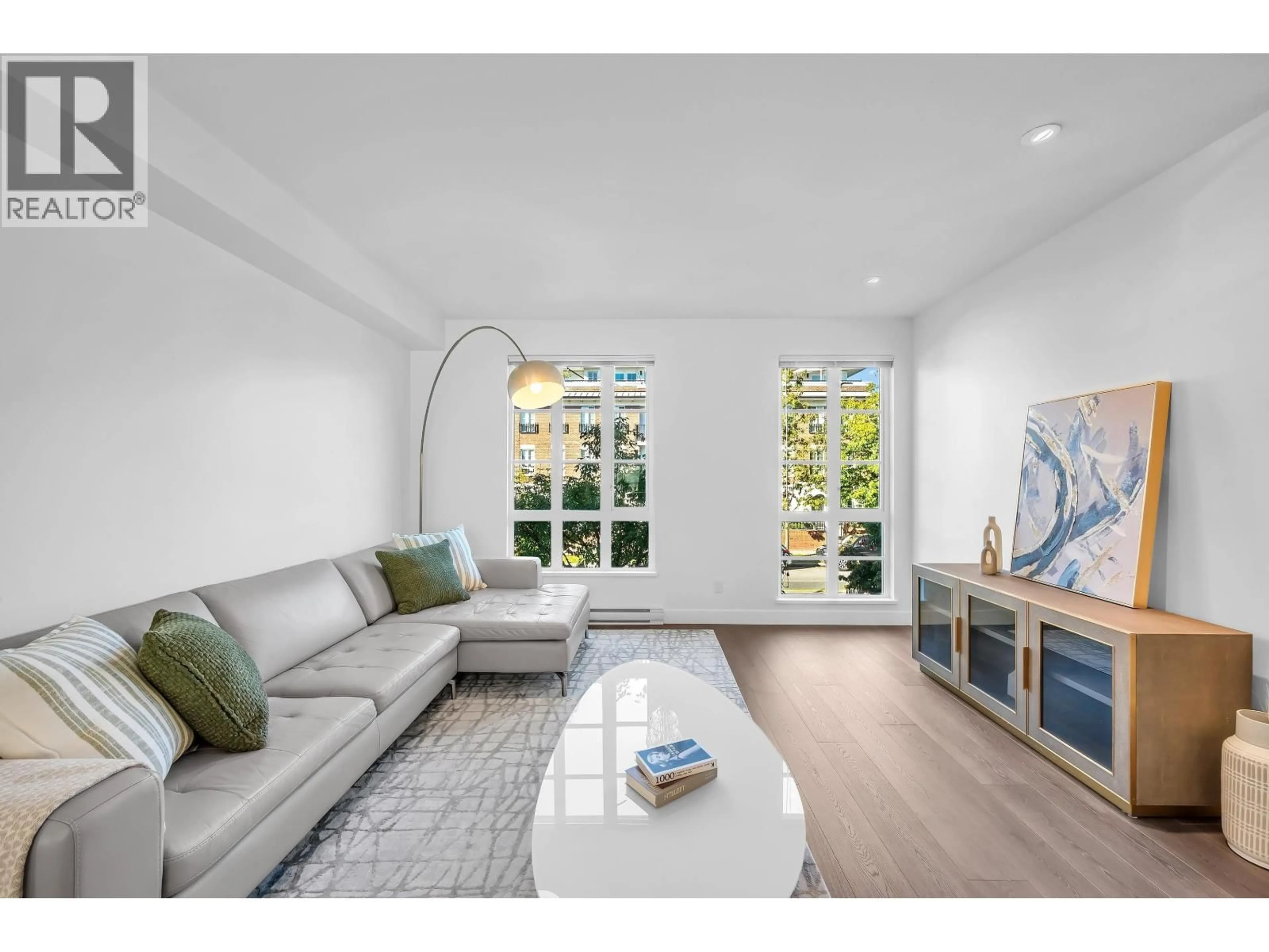 Living room with furniture, wood/laminate floor for 102 - 548 FOSTER AVENUE, Coquitlam British Columbia V3J0E2