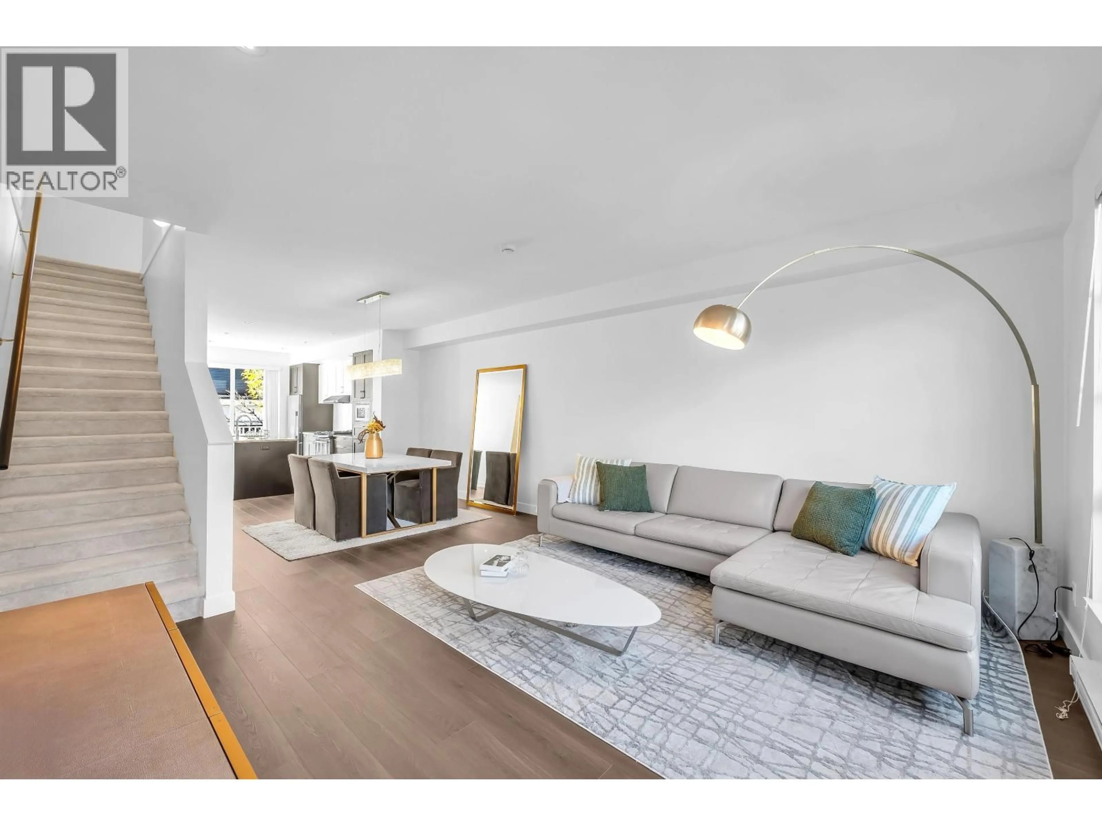 Living room with furniture, wood/laminate floor for 102 - 548 FOSTER AVENUE, Coquitlam British Columbia V3J0E2