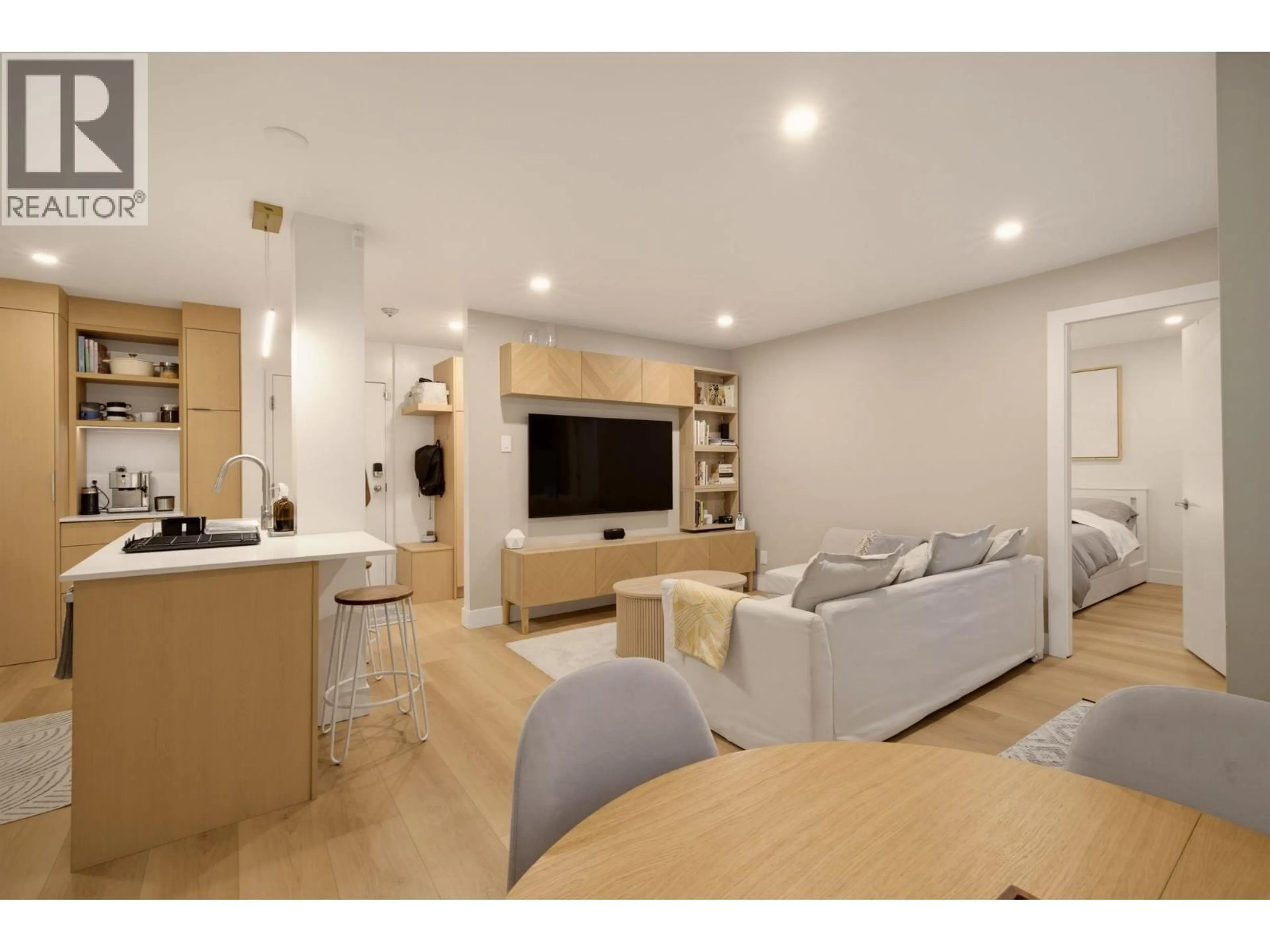 Living room with furniture, wood/laminate floor for 204 - 1345 COMOX STREET, Vancouver British Columbia V6E4E4