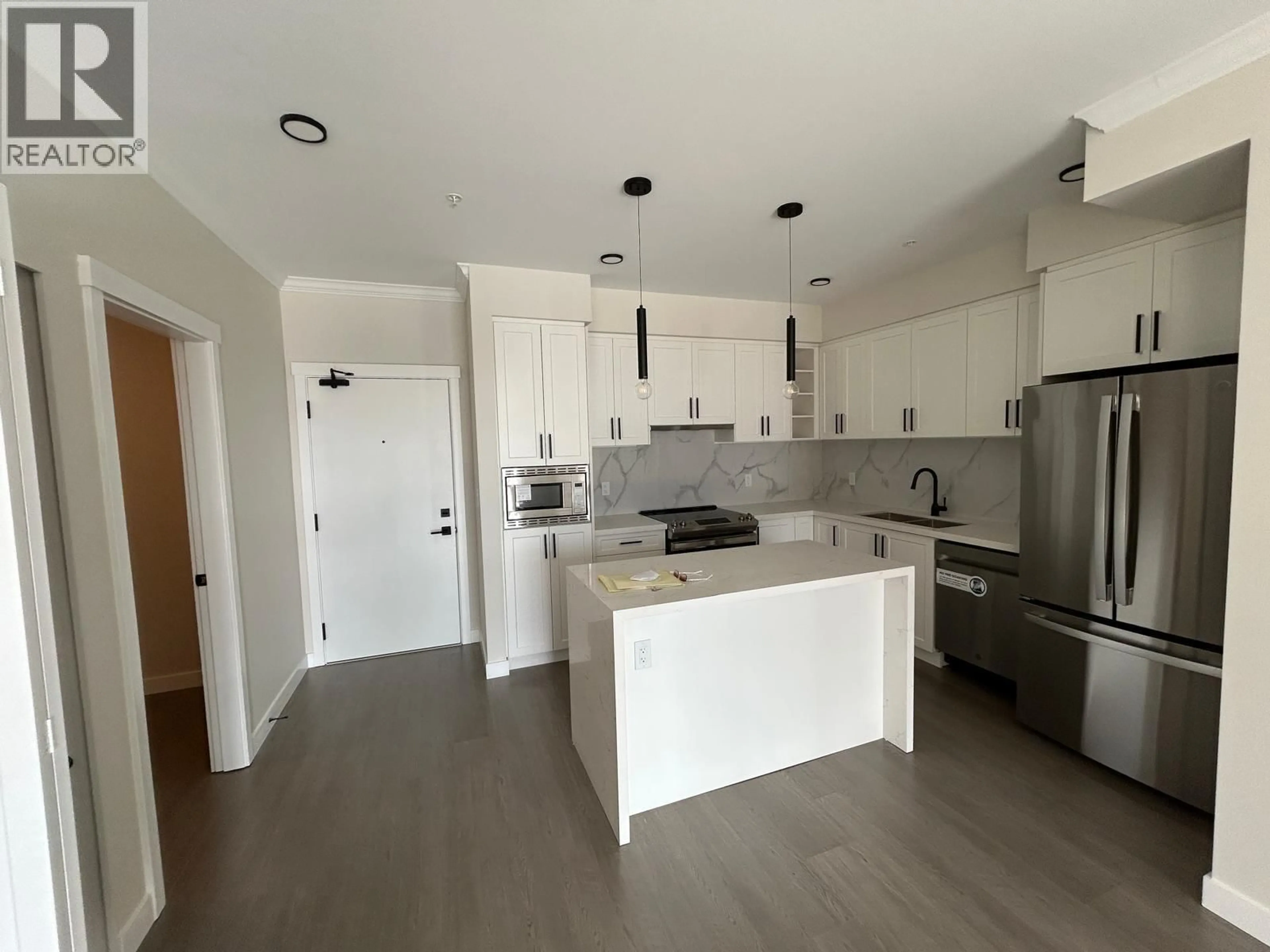 Open concept kitchen, wood/laminate floor for 423 - 12109 223 STREET, Maple Ridge British Columbia V2X5Y6