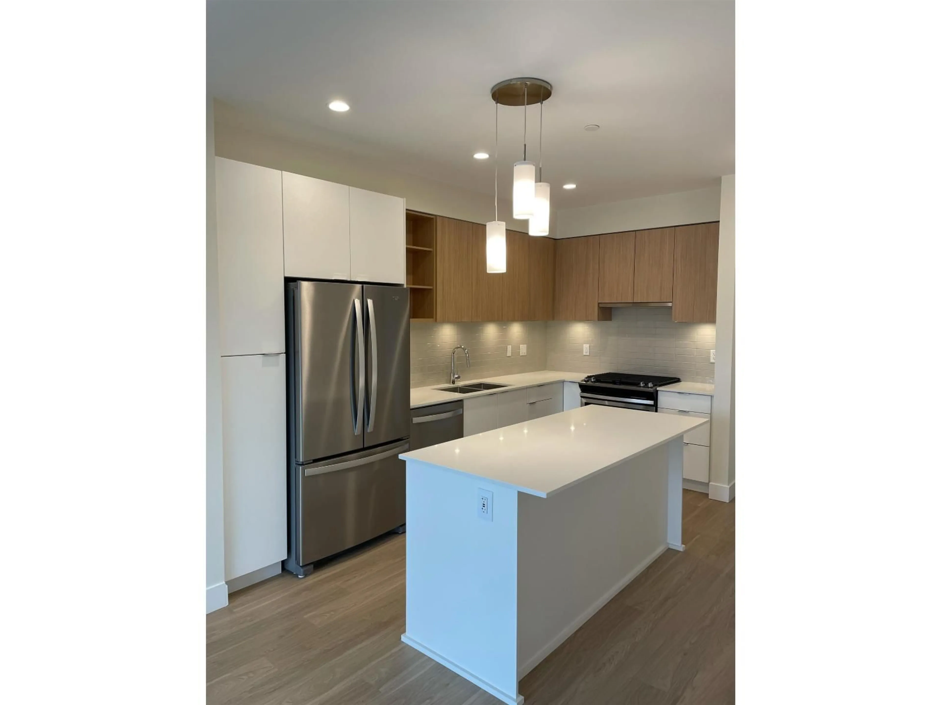 Open concept kitchen, wood/laminate floor for 416 - 6950 NICHOLSON ROAD, Delta British Columbia V4E0A8