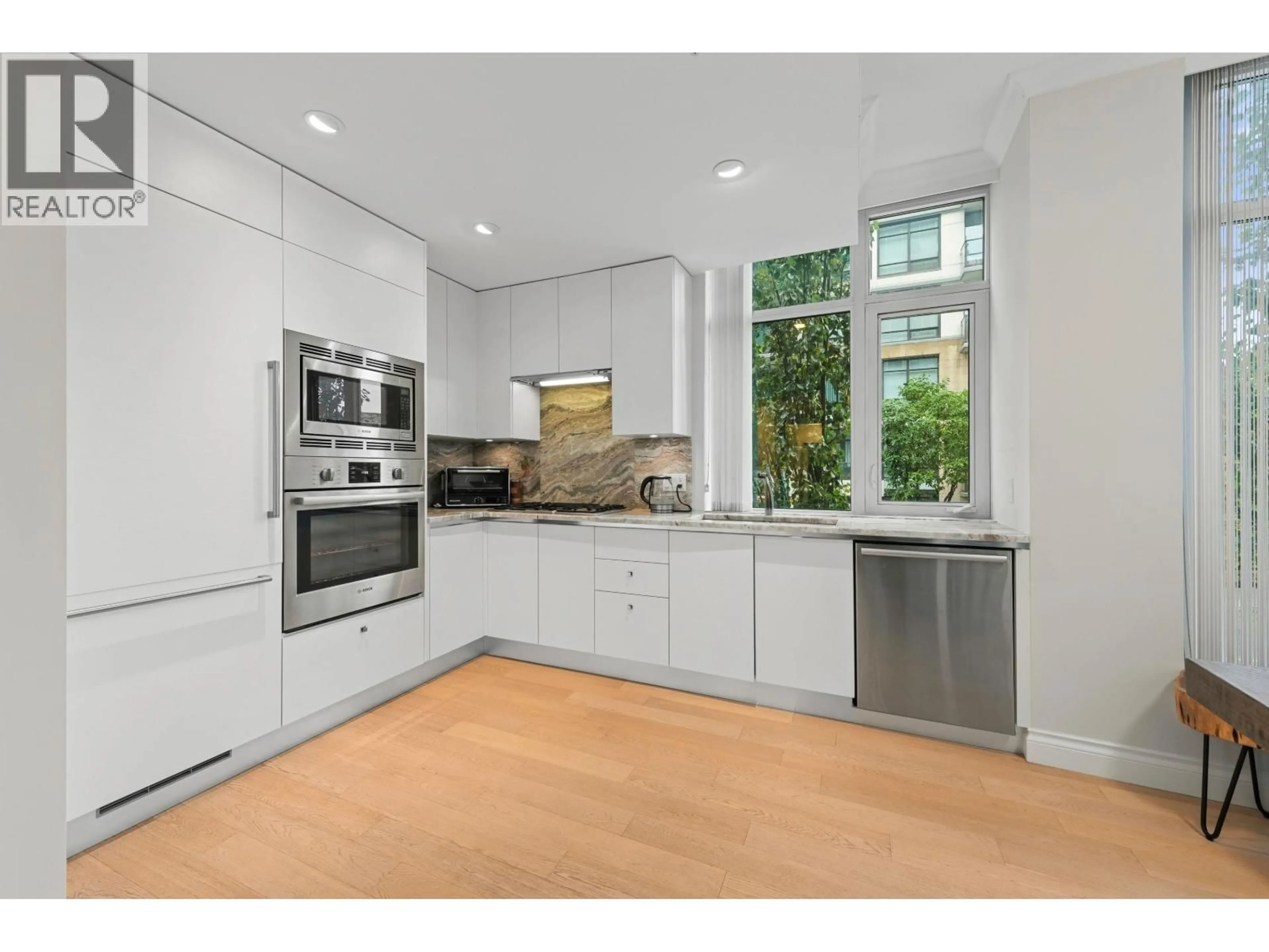Open concept kitchen, unknown for 211 - 185 VICTORY SHIP WAY, North Vancouver British Columbia V7L0G2