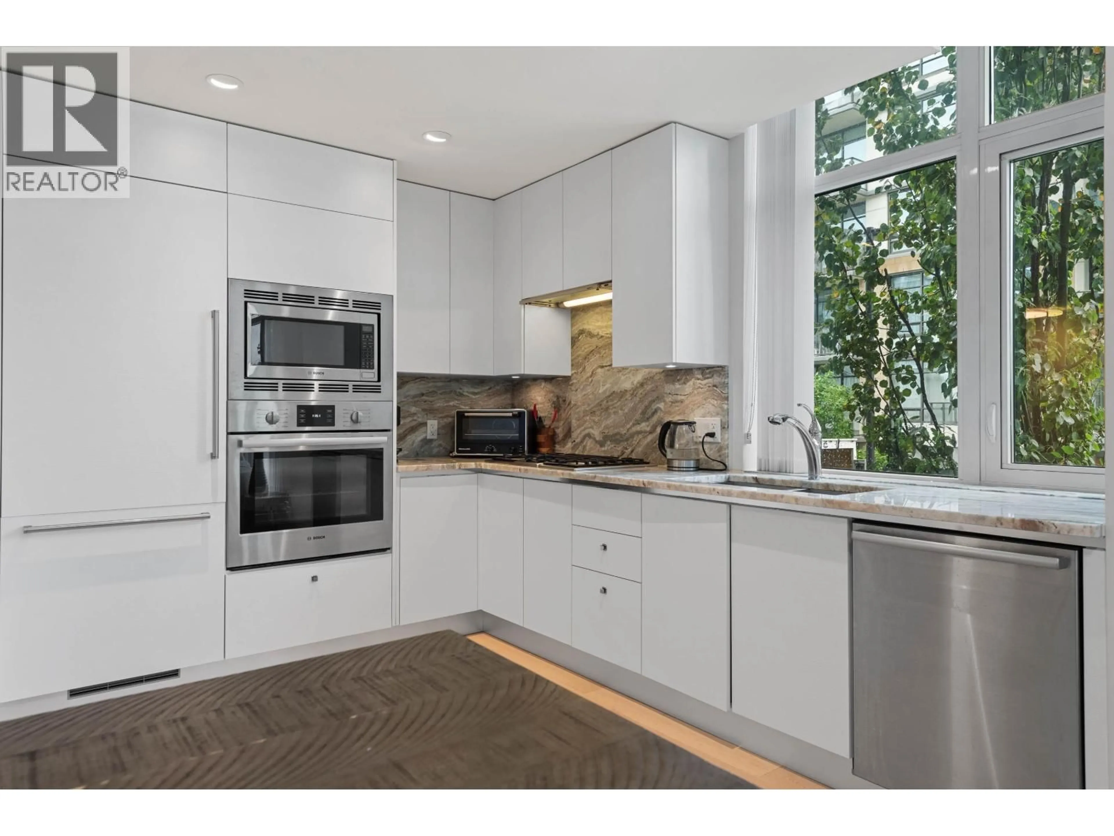 Contemporary kitchen, ceramic/tile floor for 211 - 185 VICTORY SHIP WAY, North Vancouver British Columbia V7L0G2