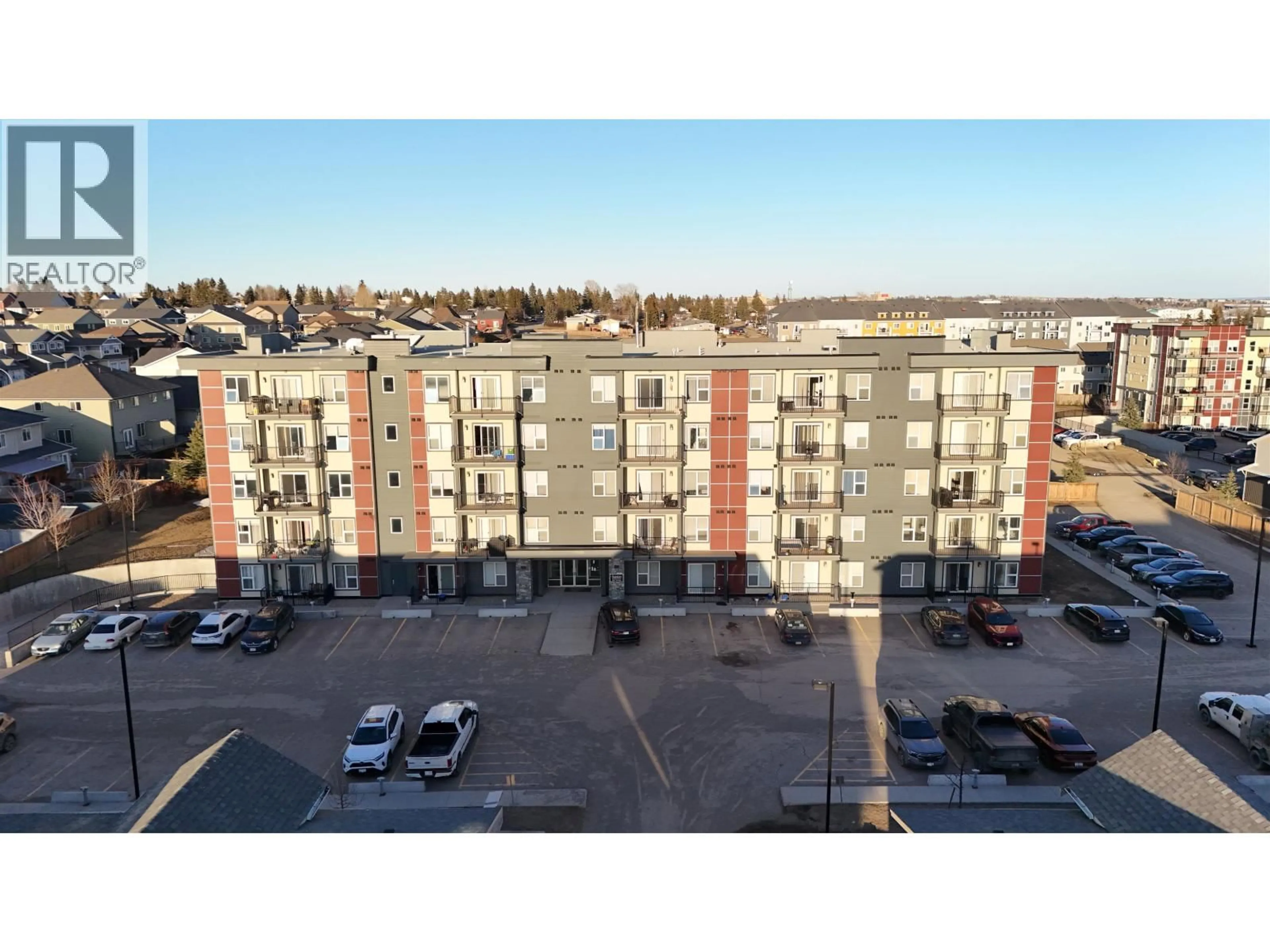 A pic from outside/outdoor area/front of a property/back of a property/a pic from drone, building for 102 - 10307 112 STREET, Fort St. John British Columbia V1J0N6