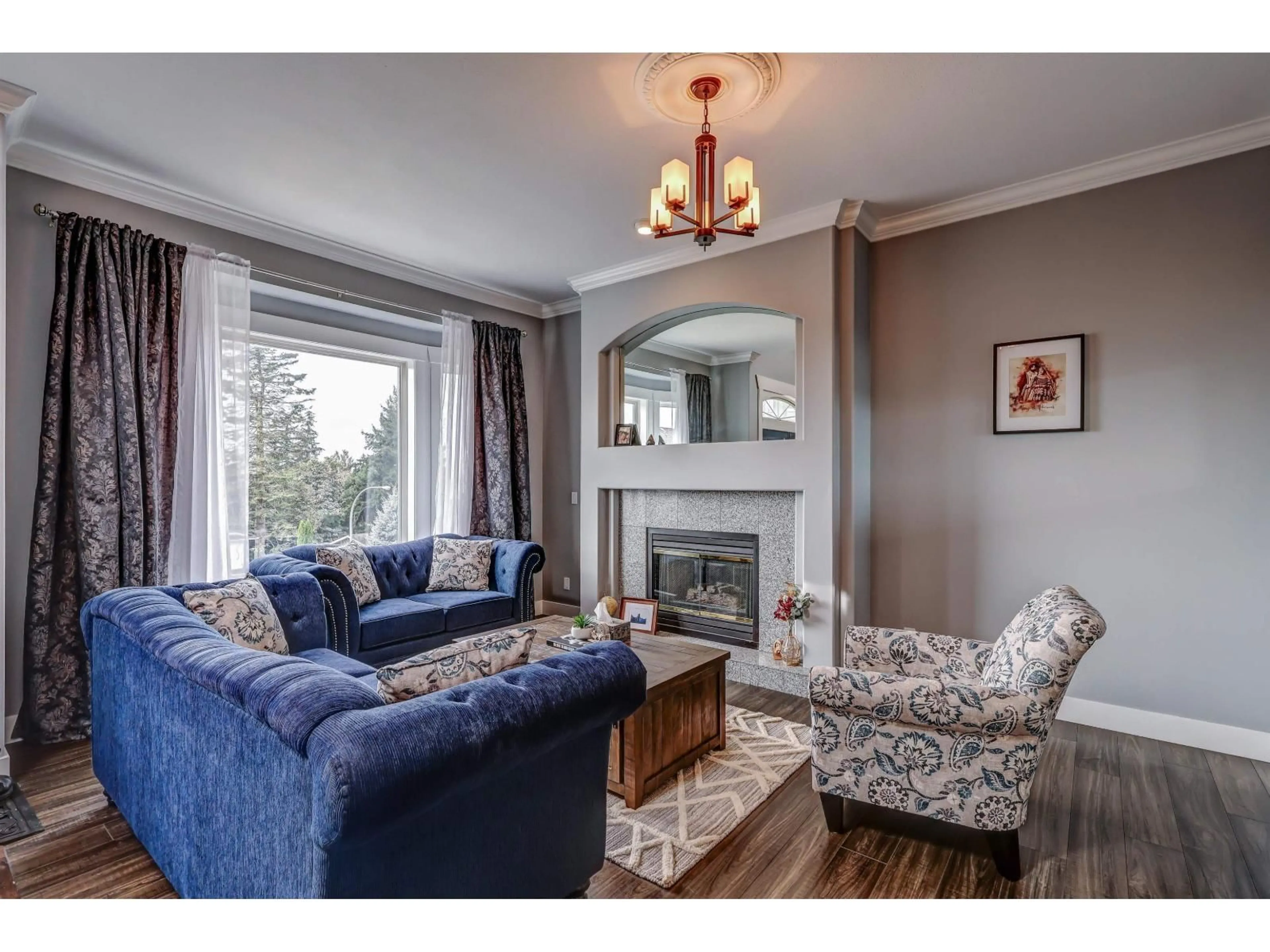 Living room with furniture, wood/laminate floor for 8222 NECHAKO DRIVE, Delta British Columbia V4C3X3