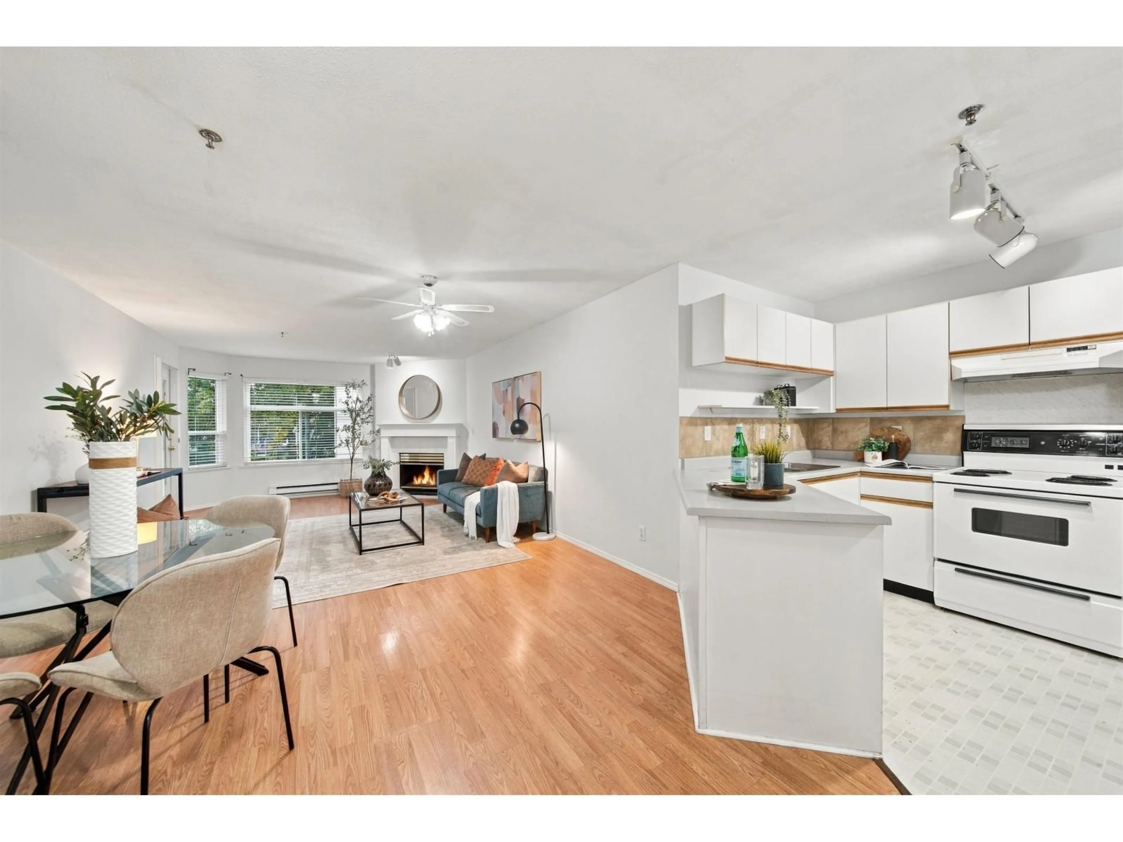Open concept kitchen, wood/laminate floor for 207 - 5955 177B STREET, Surrey British Columbia V3S4J7