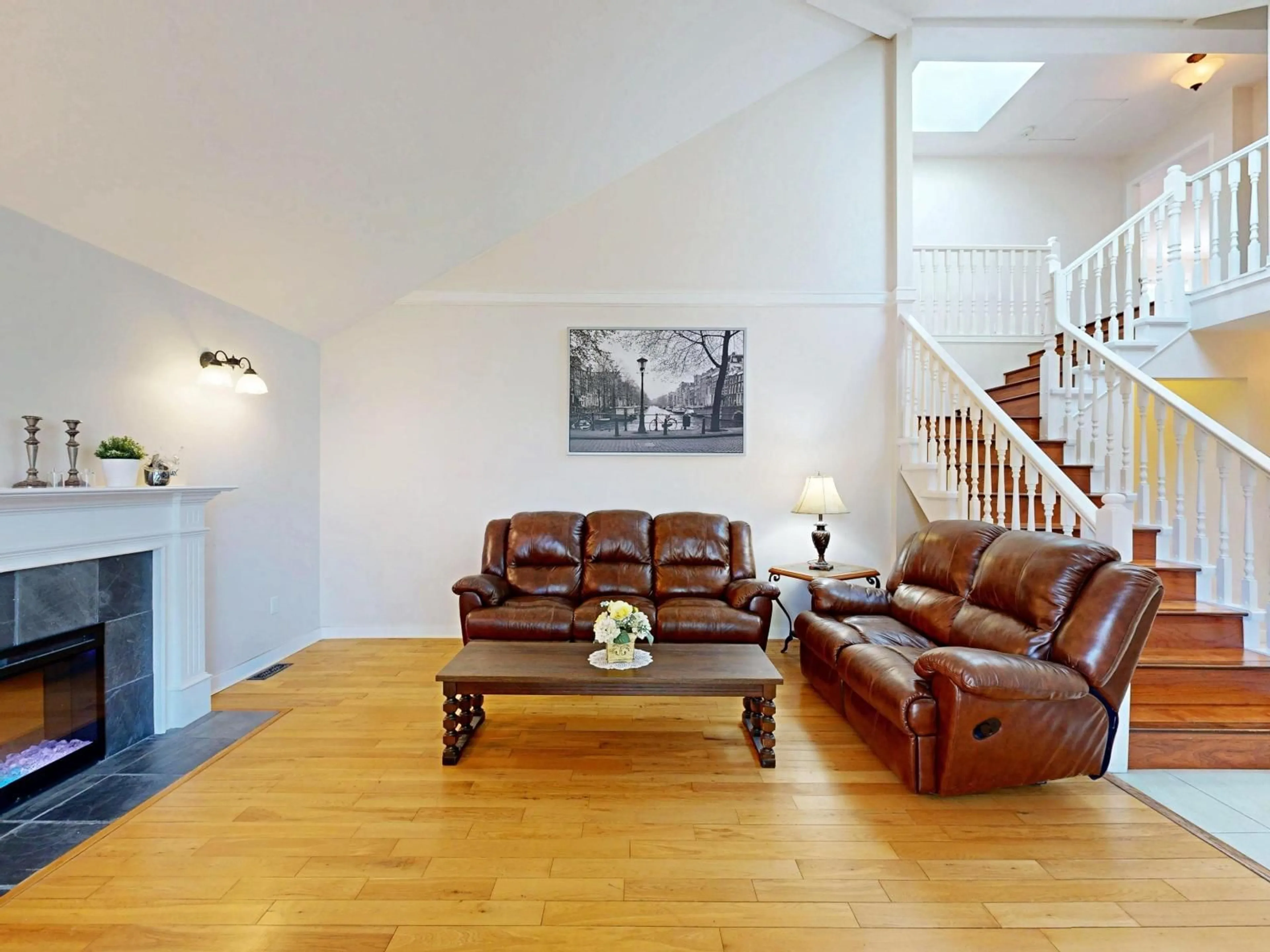 Living room with furniture, wood/laminate floor for 10285 167 STREET, Surrey British Columbia V4N1Z2