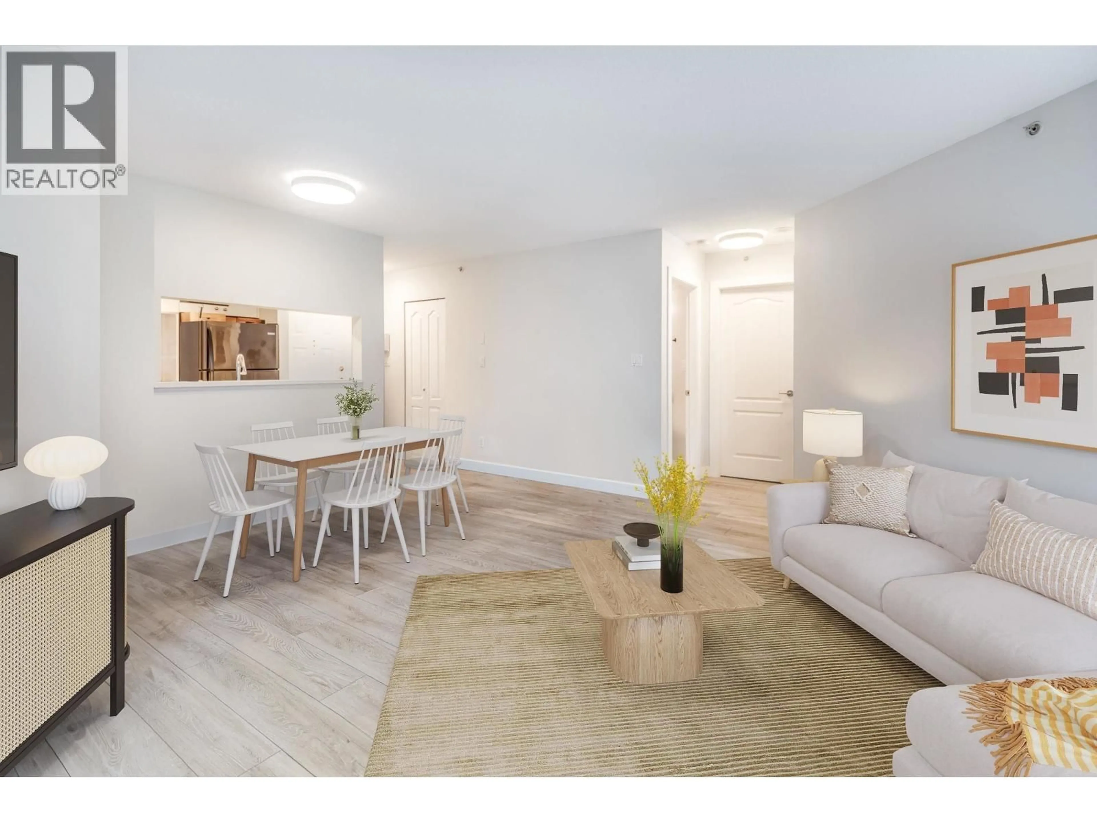 Living room with furniture, wood/laminate floor for 209 - 3455 ASCOT PLACE, Vancouver British Columbia V5R6B7