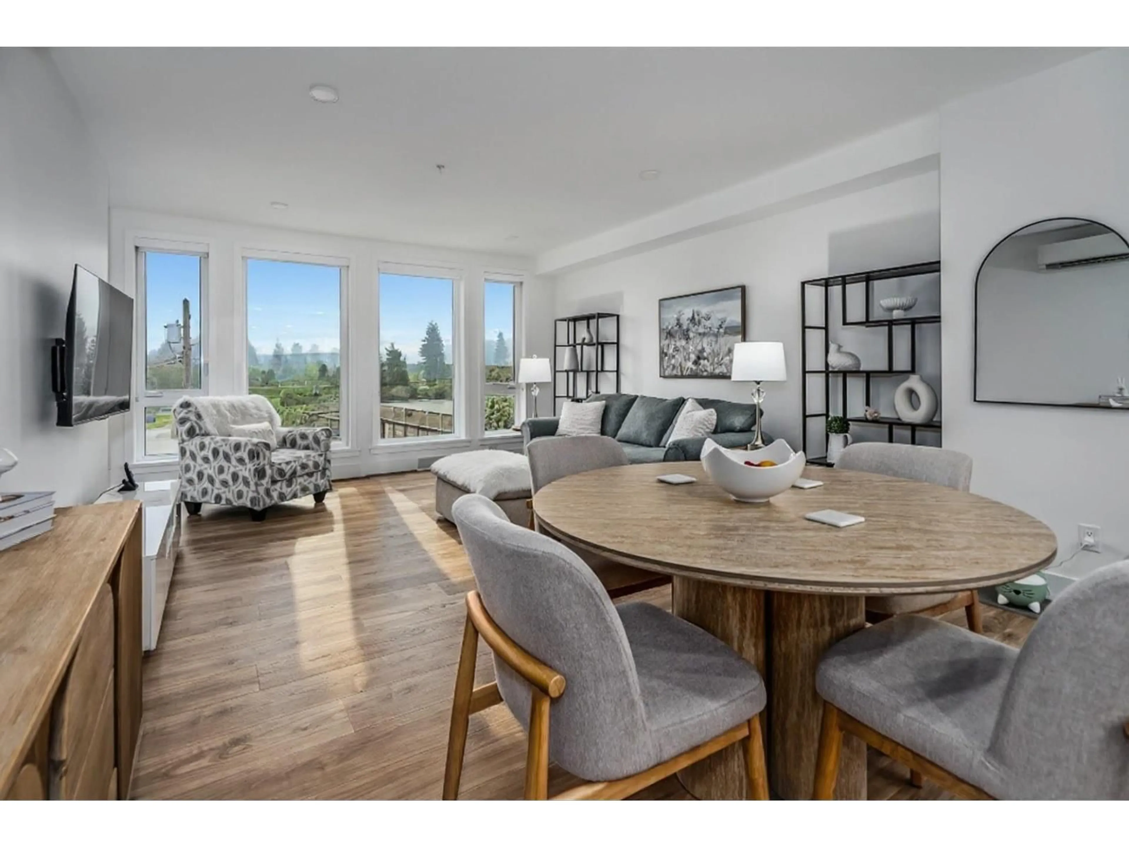 Living room with furniture, wood/laminate floor for 301 - 33160 PLAXTON CRESCENT, Abbotsford British Columbia V2Y3J6