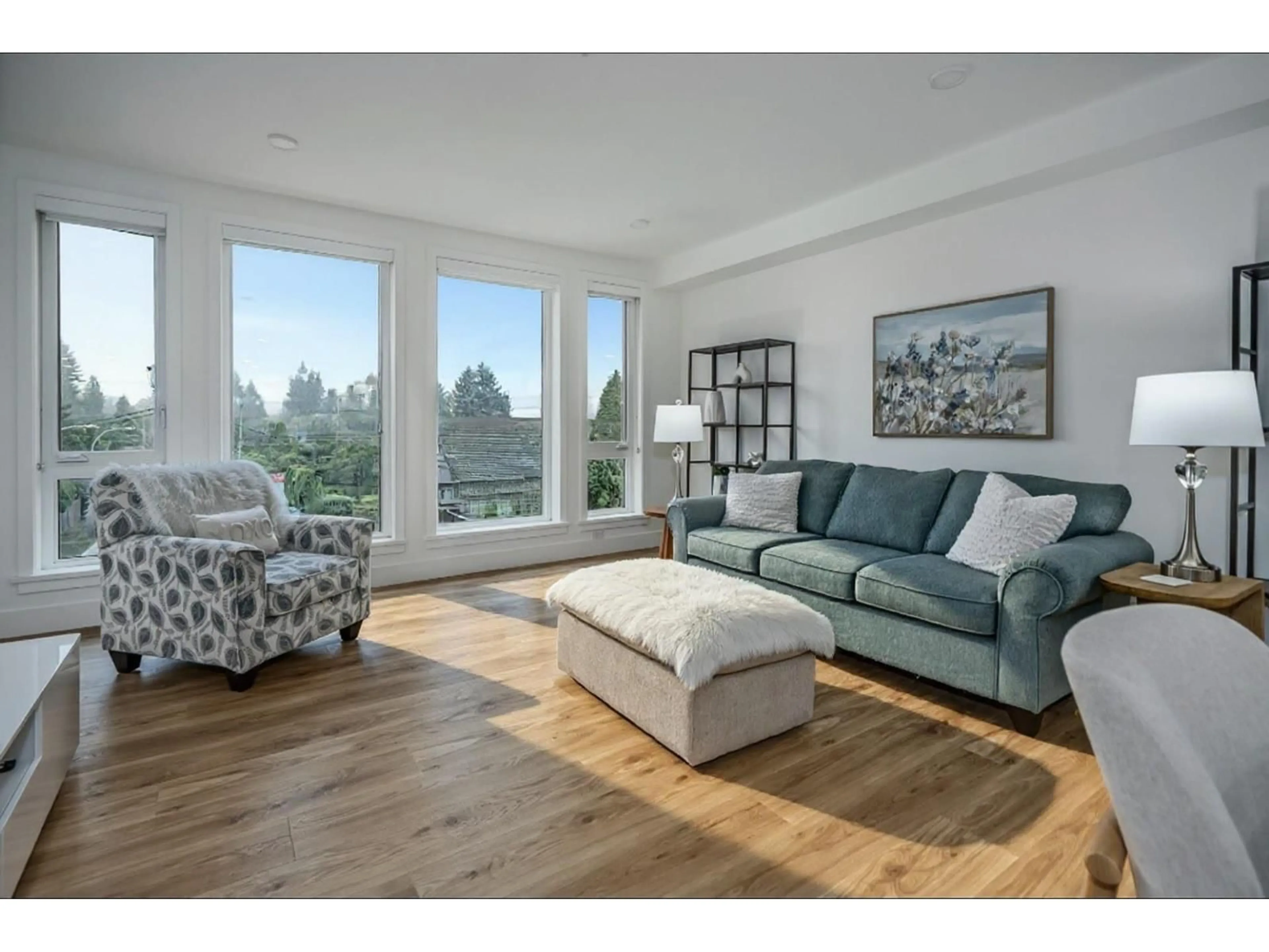 Living room with furniture, wood/laminate floor for 301 - 33160 PLAXTON CRESCENT, Abbotsford British Columbia V2Y3J6