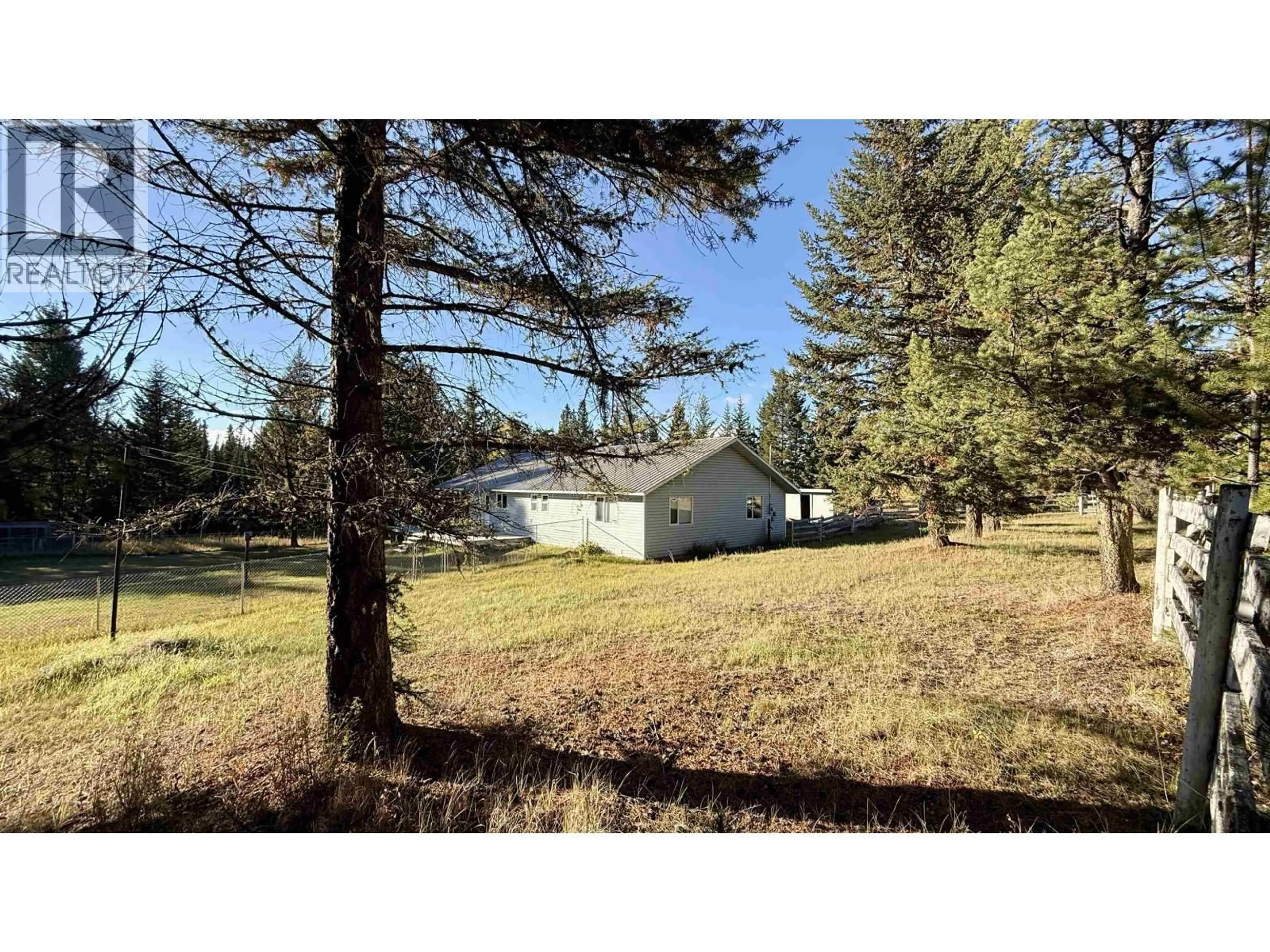 A pic from outside/outdoor area/front of a property/back of a property/a pic from drone, forest/trees view for 6784 BARNETT ROAD, 100 Mile House British Columbia V0K2E2