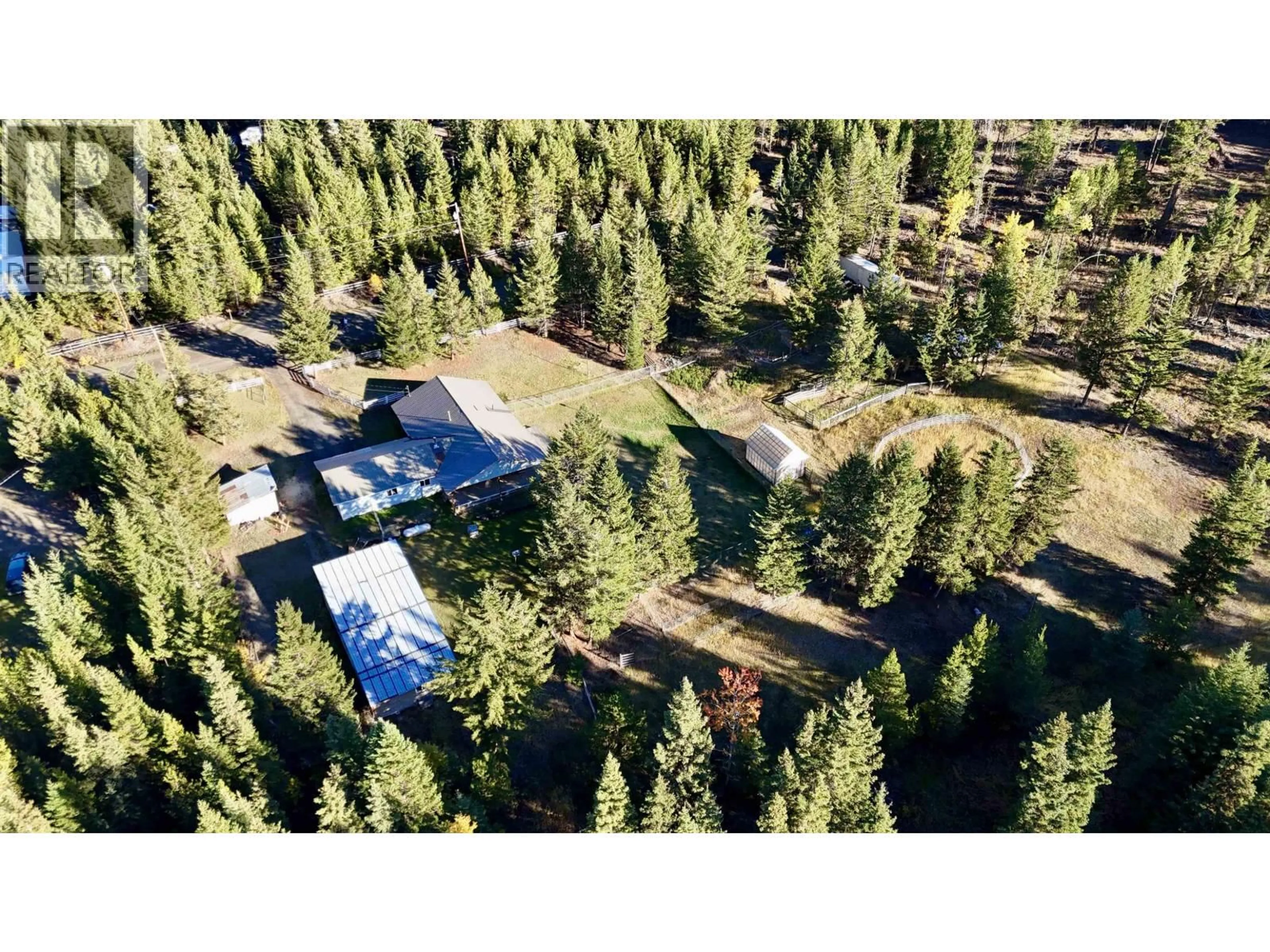 A pic from outside/outdoor area/front of a property/back of a property/a pic from drone, forest/trees view for 6784 BARNETT ROAD, 100 Mile House British Columbia V0K2E2