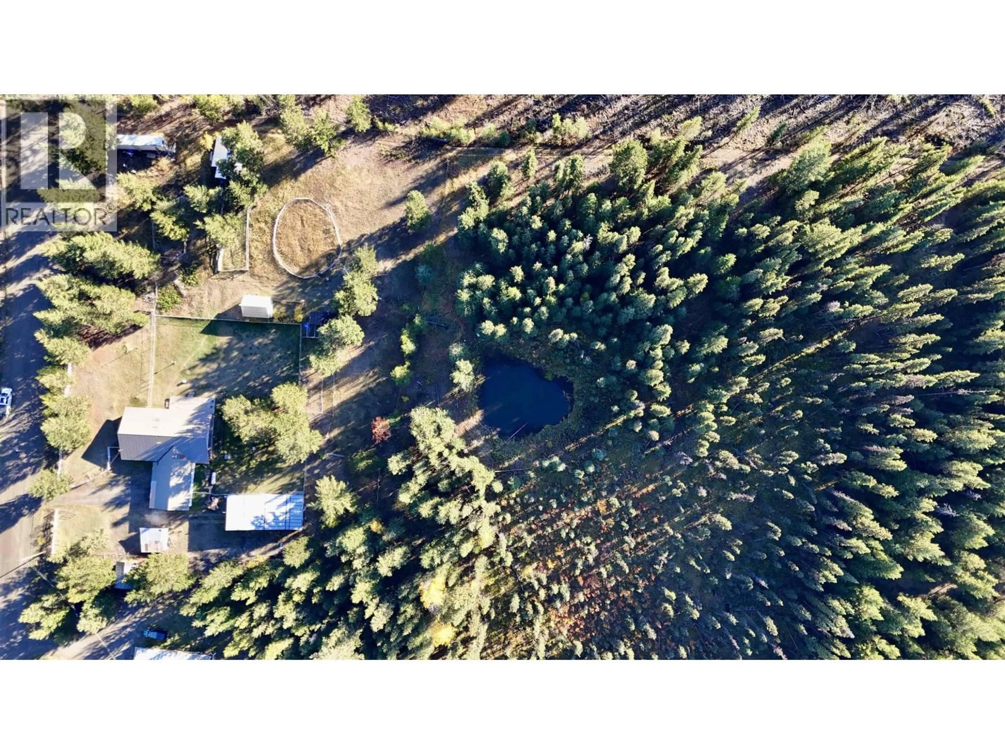 A pic from outside/outdoor area/front of a property/back of a property/a pic from drone, forest/trees view for 6784 BARNETT ROAD, 100 Mile House British Columbia V0K2E2