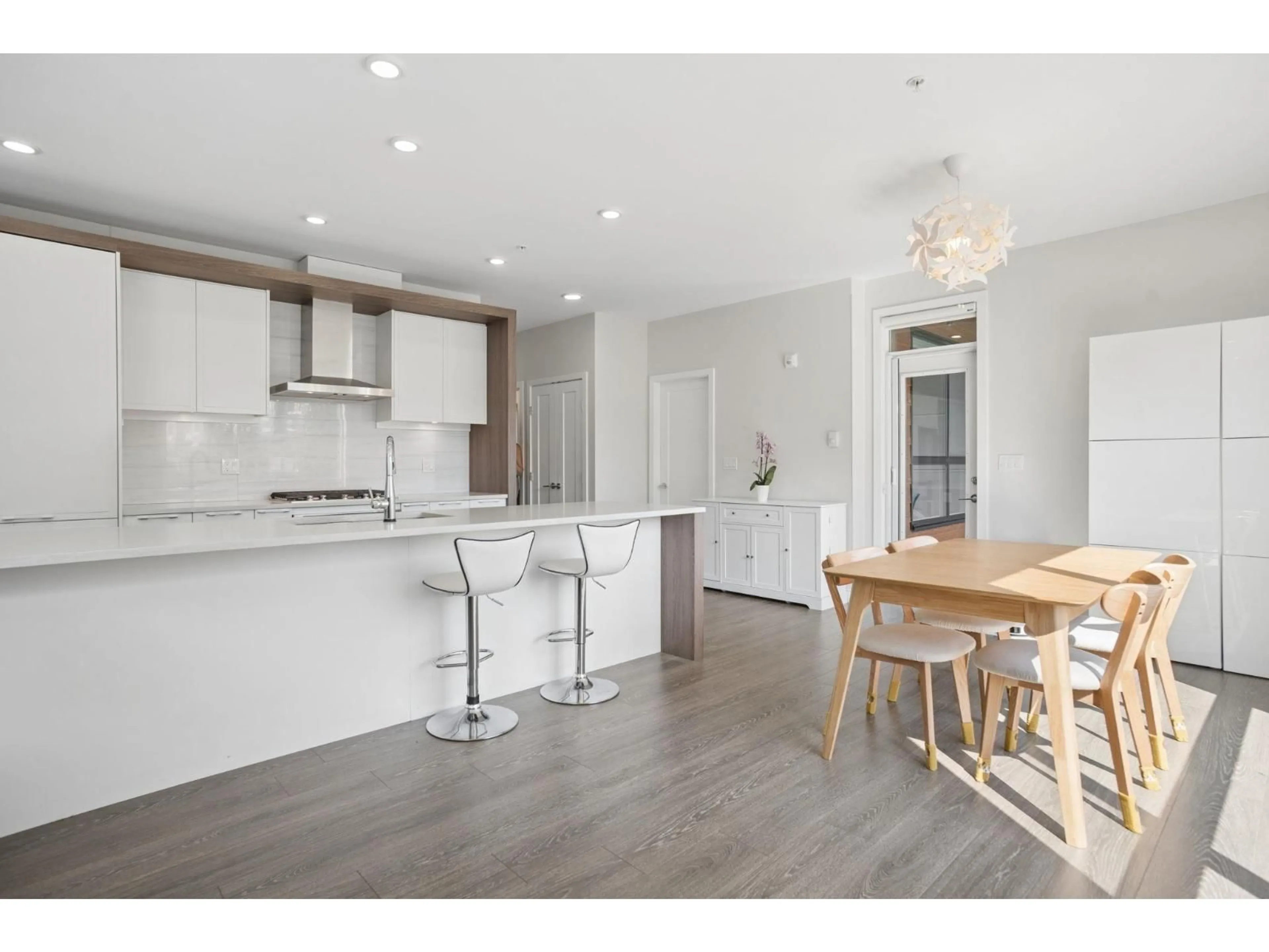 Open concept kitchen, wood/laminate floor for 216 - 11507 84 AVENUE, Delta British Columbia V4C0E5