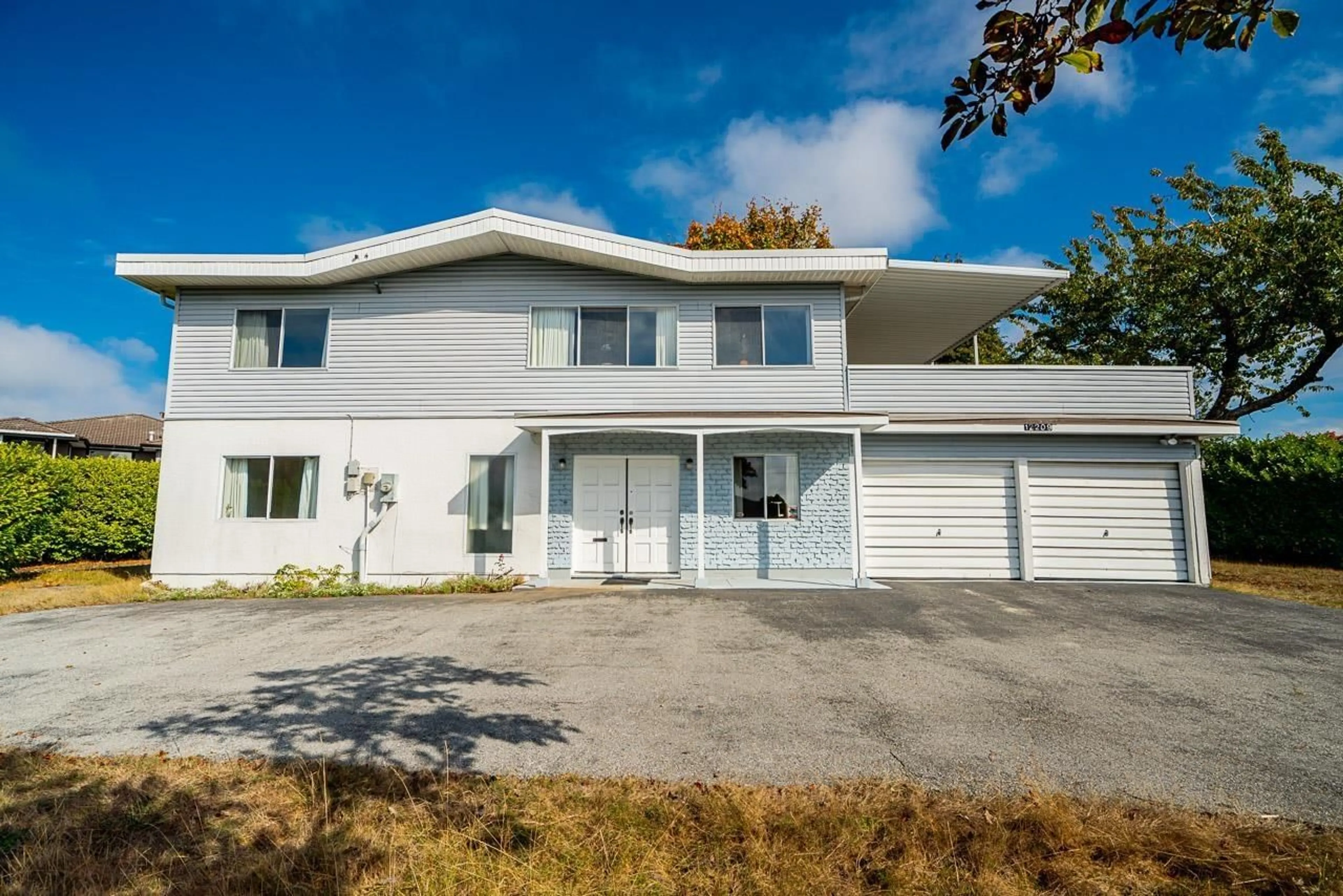 Home with vinyl exterior material, street for 12209 64 AVENUE, Surrey British Columbia V3W1W6