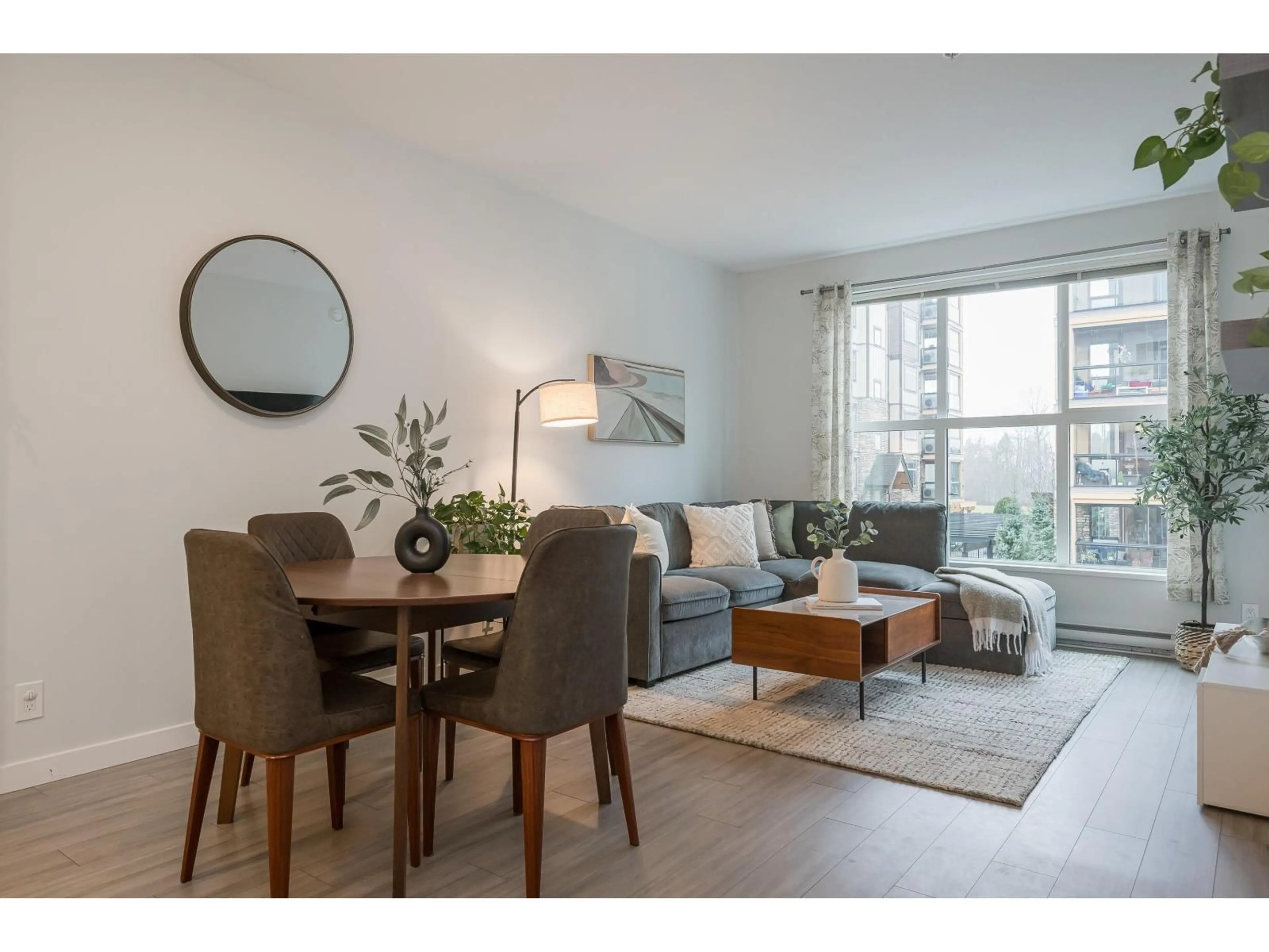 Living room with furniture, wood/laminate floor for A216 - 8150 207 STREET, Langley British Columbia V2Y4J2
