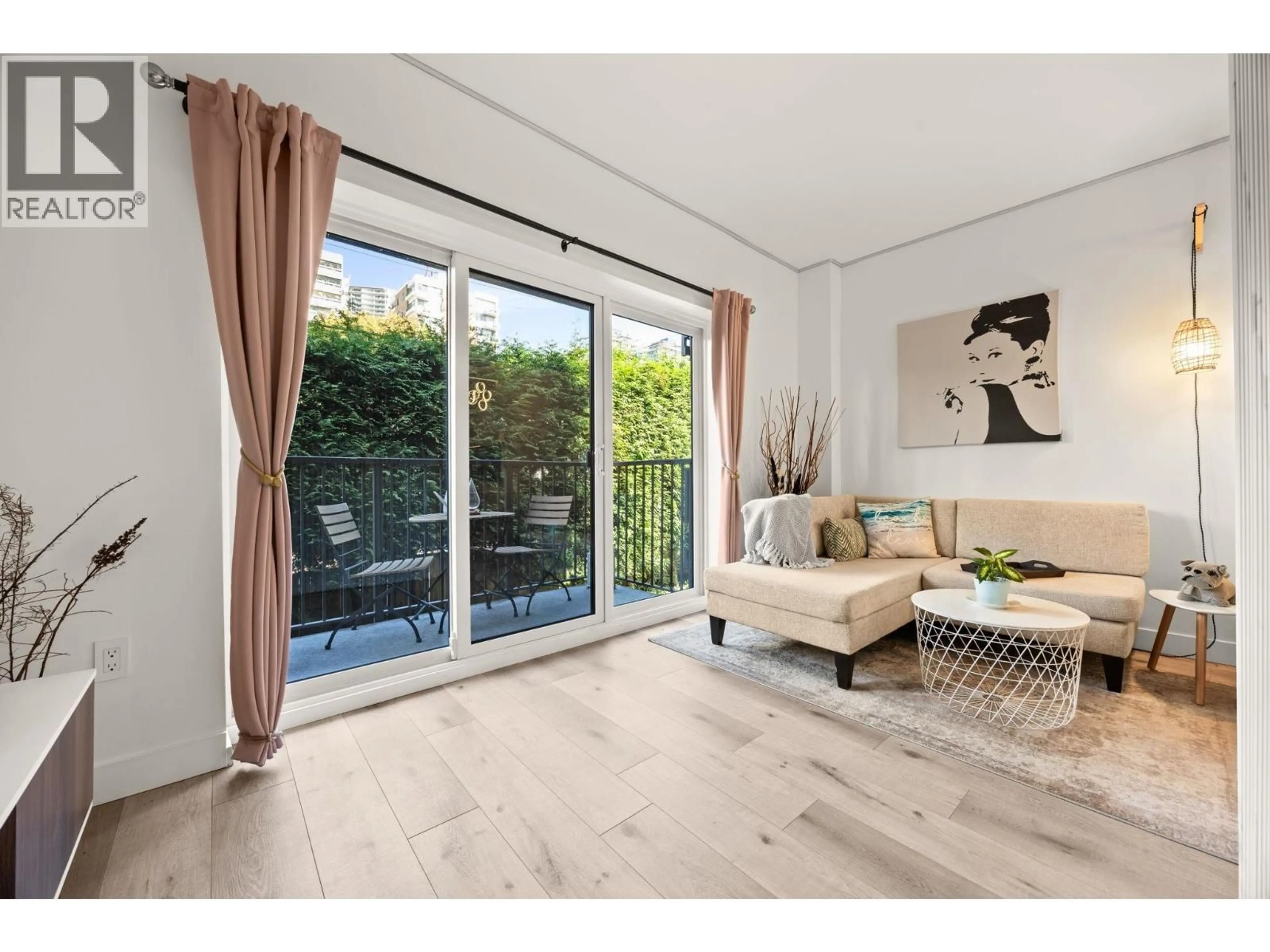 Living room with furniture, wood/laminate floor for 207 - 1655 NELSON STREET, Vancouver British Columbia V6G1M4
