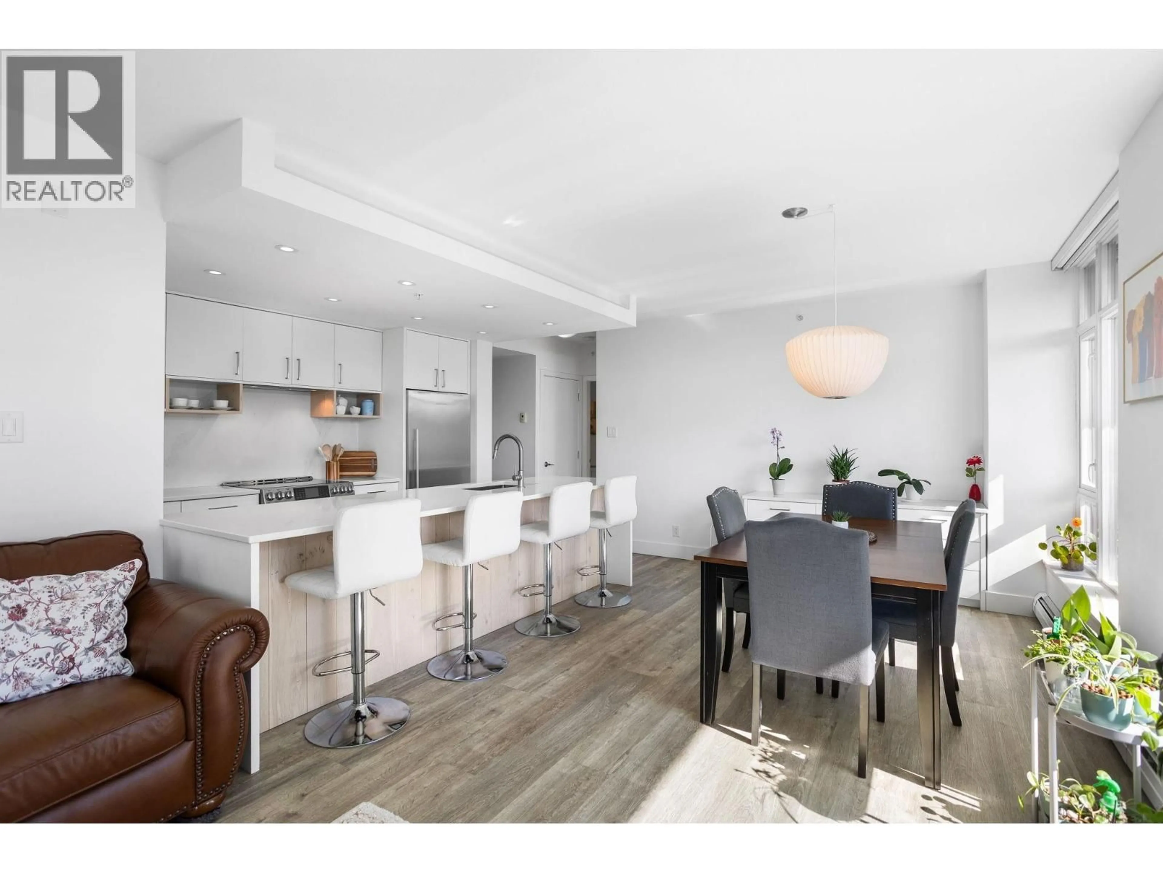 Open concept kitchen, wood/laminate floor for 306 - 158 13TH STREET, North Vancouver British Columbia V7M0A7