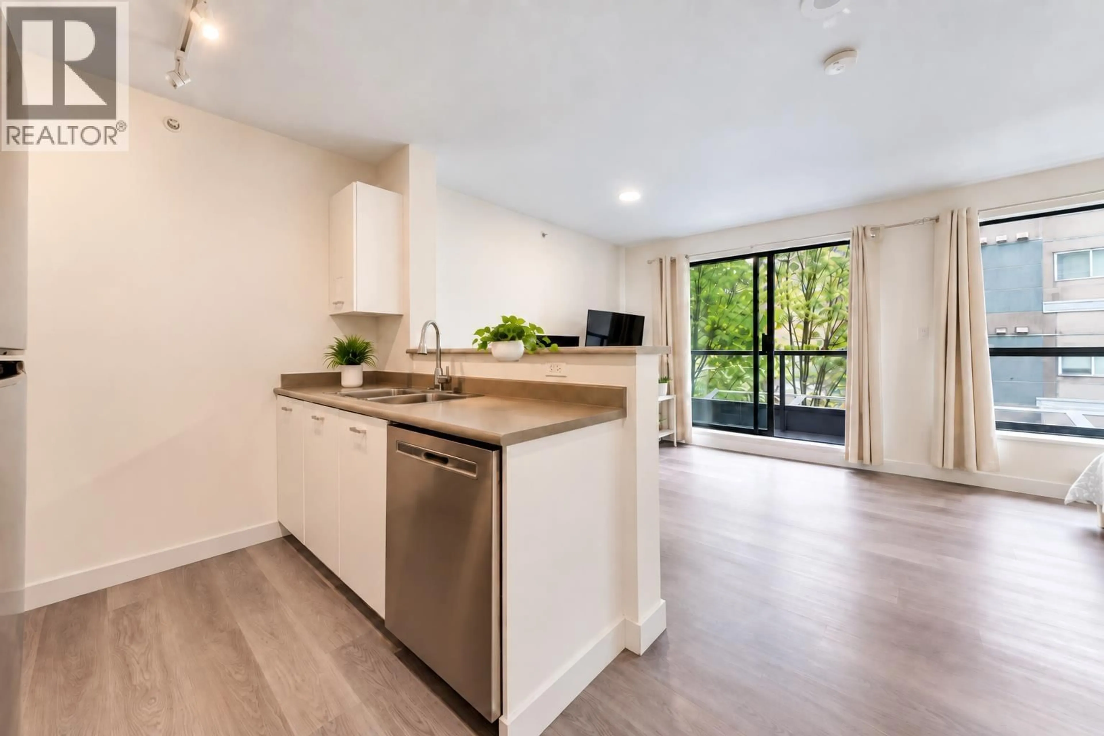 Open concept kitchen, unknown for 205 - 3438 VANNESS AVENUE, Vancouver British Columbia V5R6E7