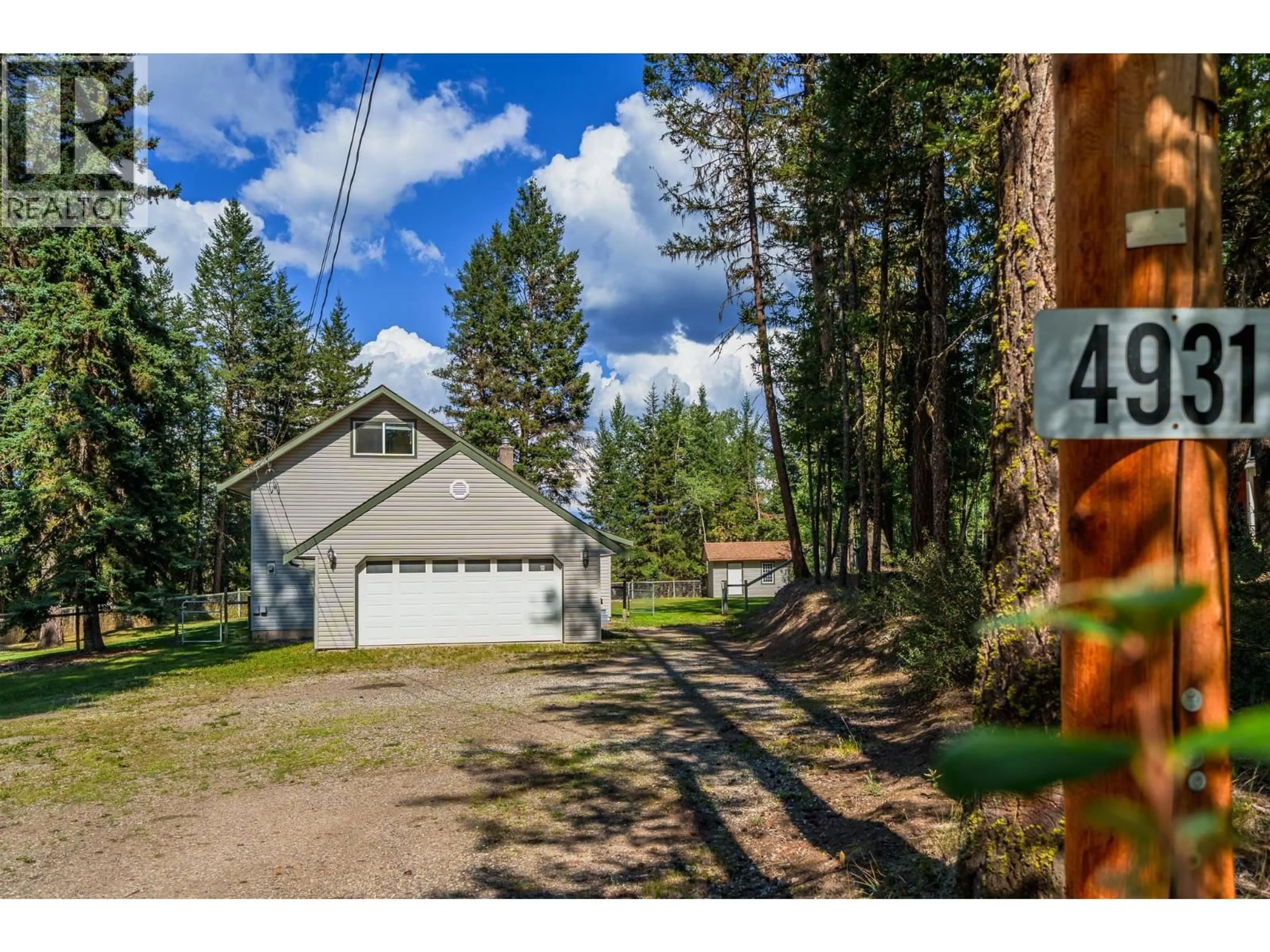 A pic from outside/outdoor area/front of a property/back of a property/a pic from drone, forest/trees view for 4931 KYLLO ROAD, 108 Mile Ranch British Columbia V0K2Z0