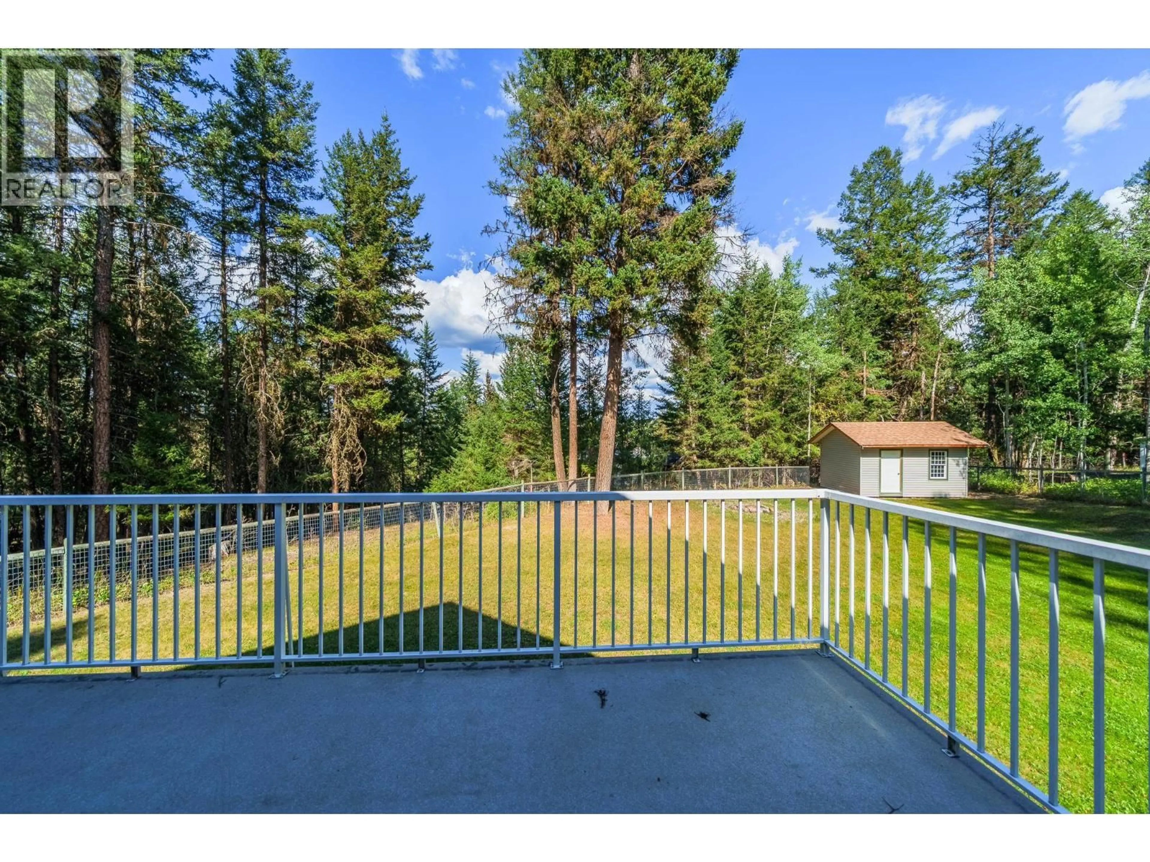A pic from outside/outdoor area/front of a property/back of a property/a pic from drone, forest/trees view for 4931 KYLLO ROAD, 108 Mile Ranch British Columbia V0K2Z0
