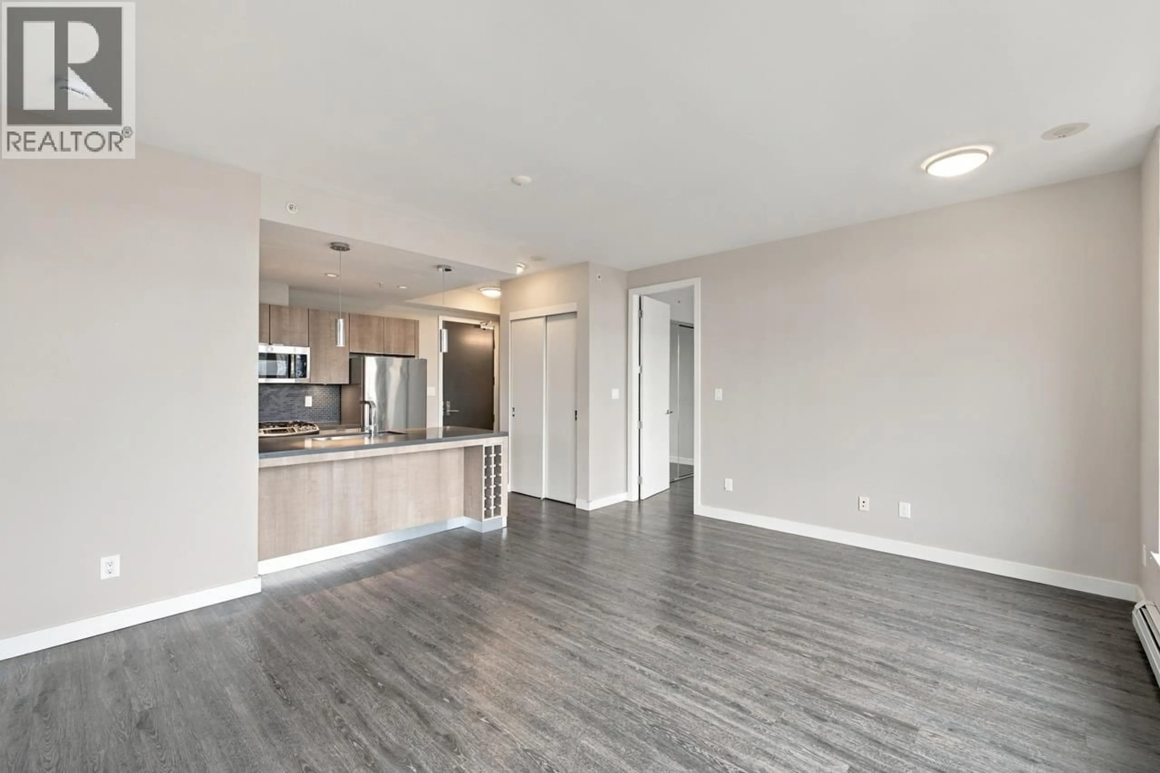 Open concept kitchen, wood/laminate floor for 402 - 1788 ONTARIO STREET, Vancouver British Columbia V5T0G3