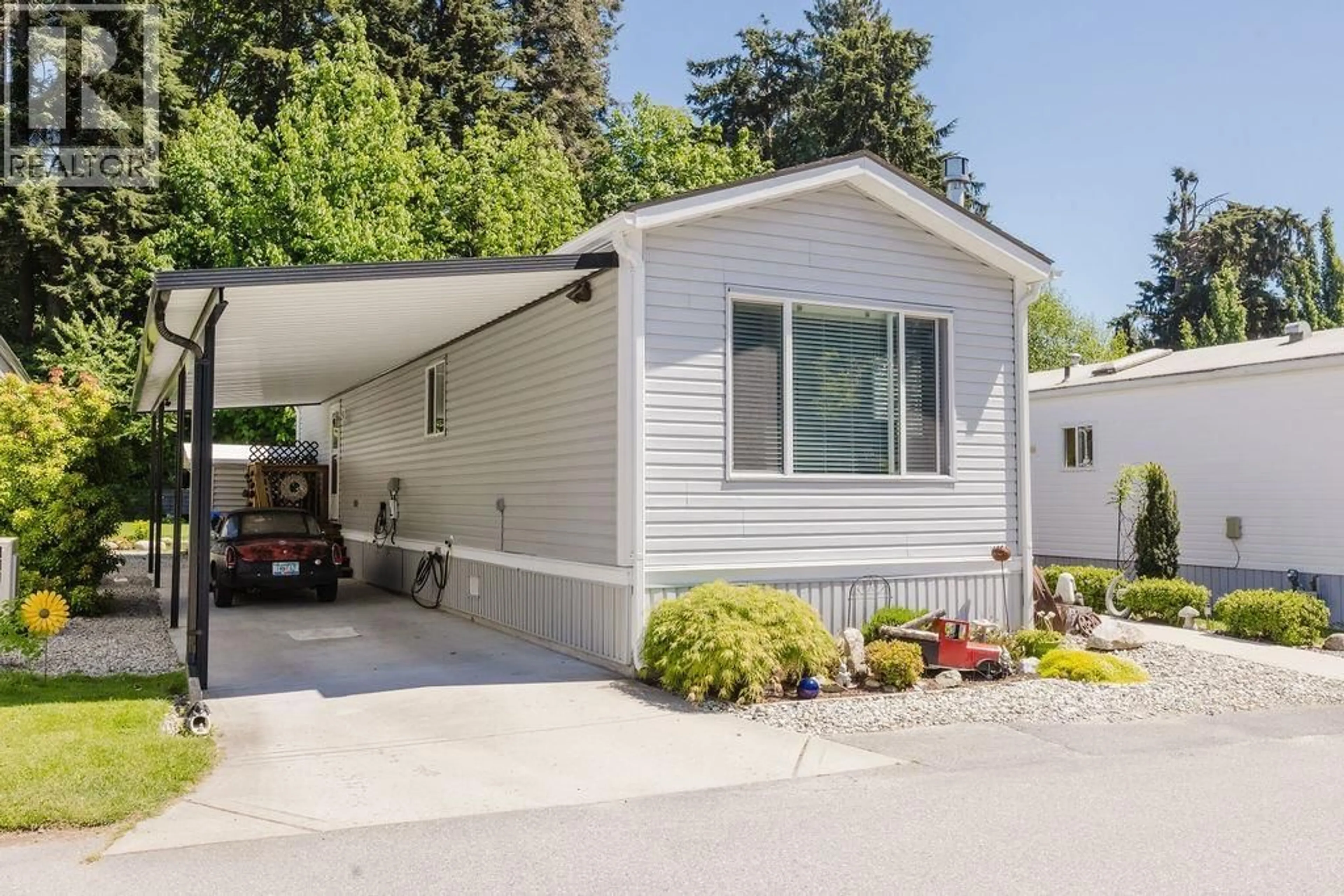 Home with vinyl exterior material, street for 13 - 4496 SUNSHINE COAST HIGHWAY, Sechelt British Columbia V7Z0C3