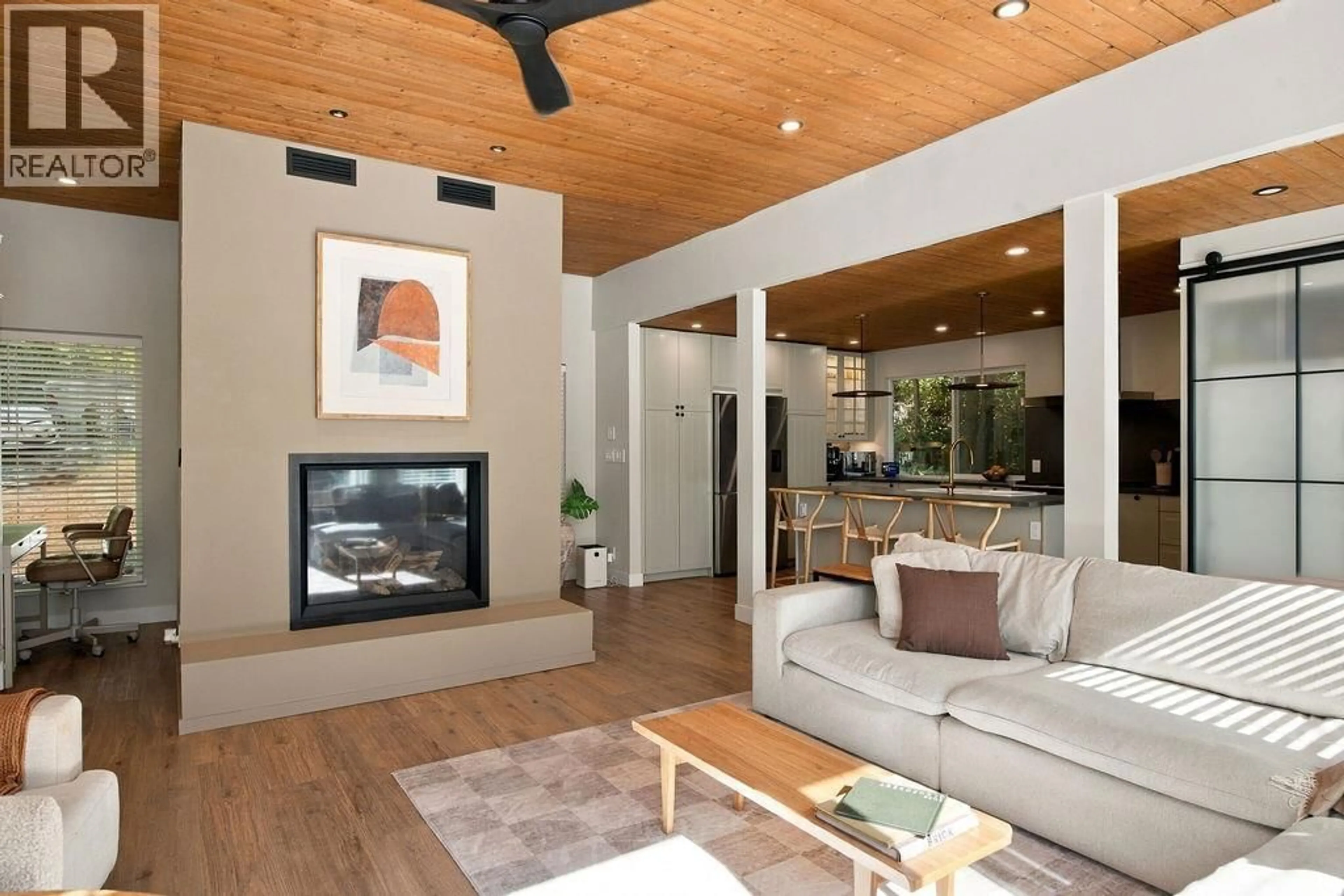 Living room with furniture, wood/laminate floor for 1991 COACH ROAD, Roberts Creek British Columbia V0N2W6