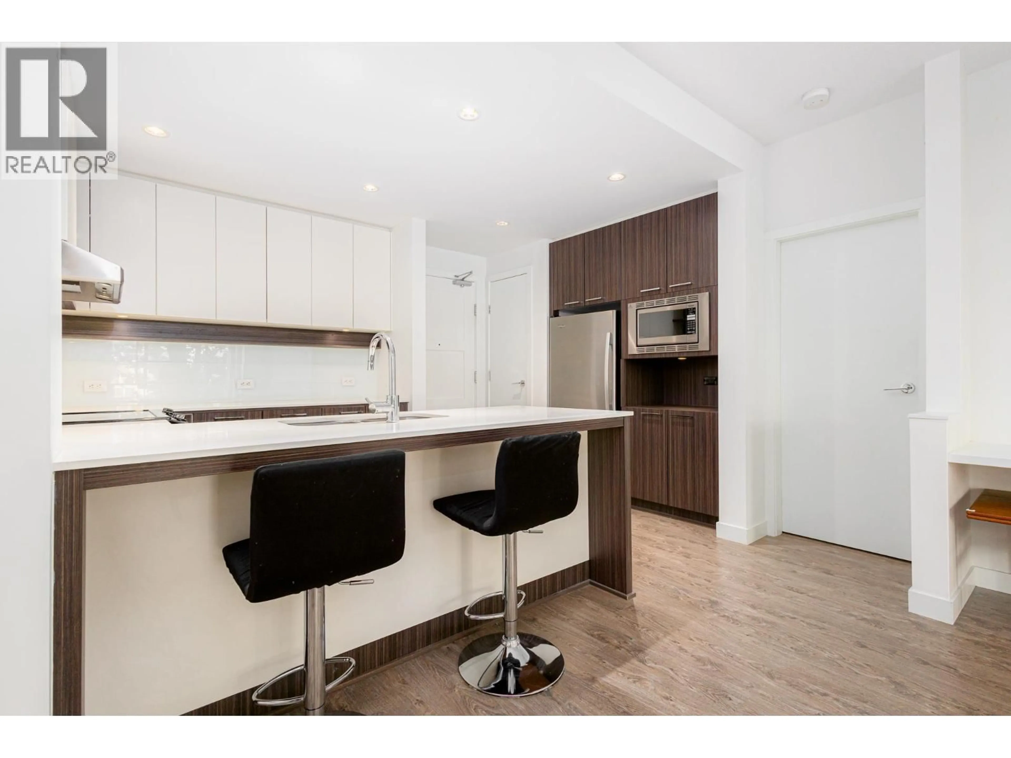 Open concept kitchen, wood/laminate floor for 203 - 545 FOSTER AVENUE, Coquitlam British Columbia V3J0B3