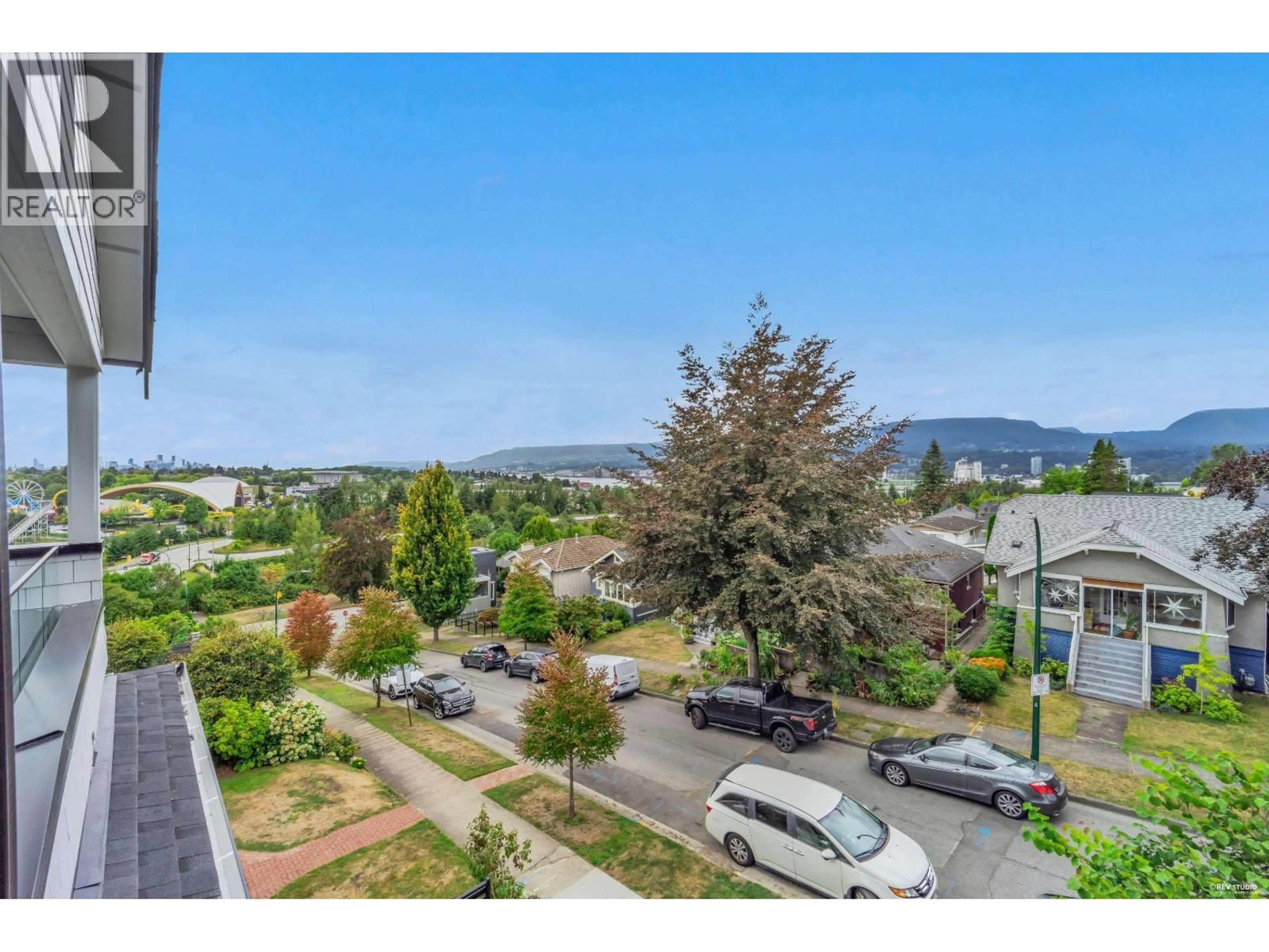 A pic from outside/outdoor area/front of a property/back of a property/a pic from drone, mountain view for 1 - 3436 TRIUMPH STREET, Vancouver British Columbia V5K1T8