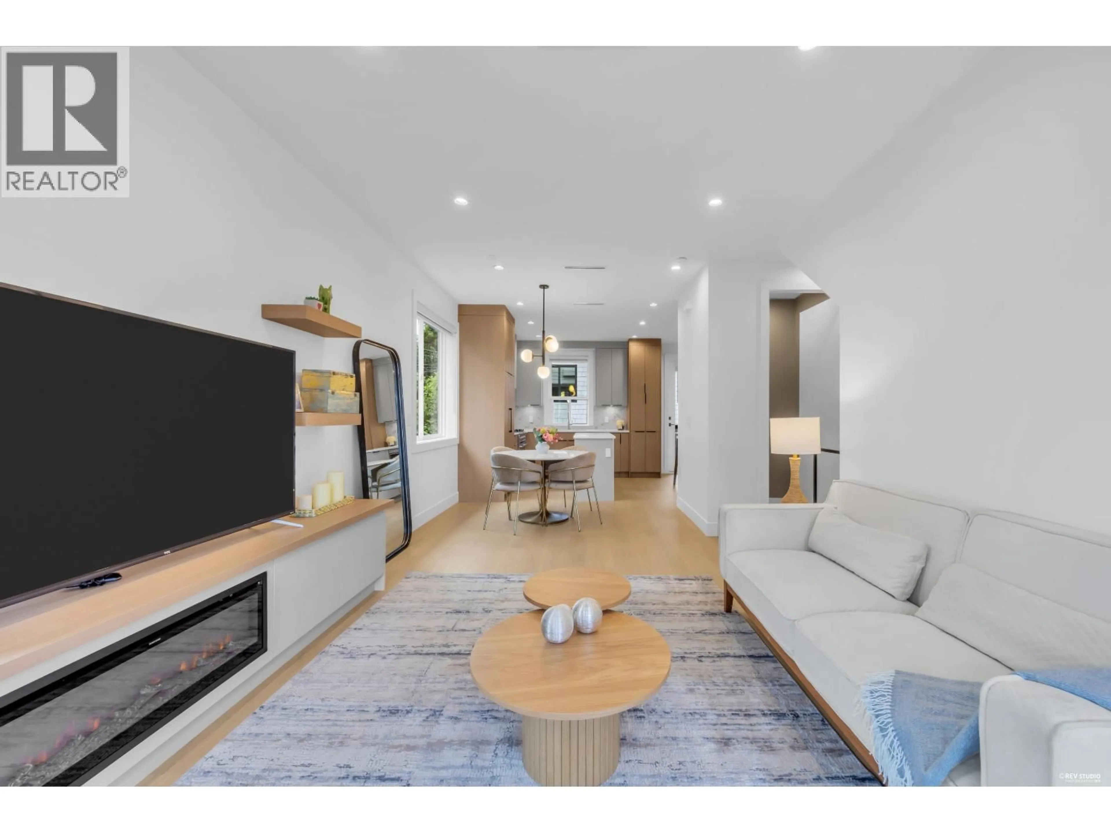 Living room with furniture, wood/laminate floor for 1 - 3436 TRIUMPH STREET, Vancouver British Columbia V5K1T8
