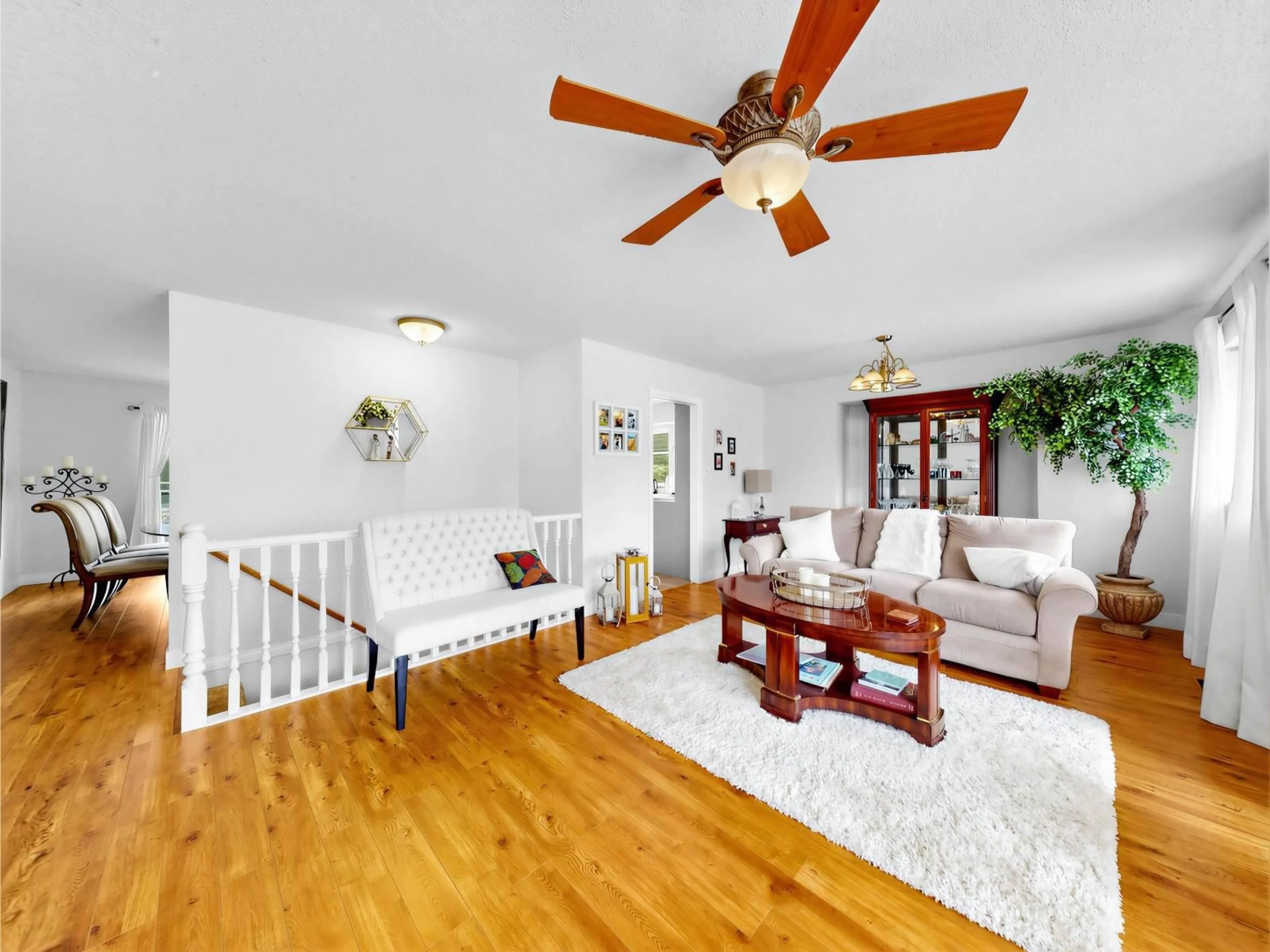 Living room with furniture, wood/laminate floor for 8621 215 STREET, Langley British Columbia V1M2G4