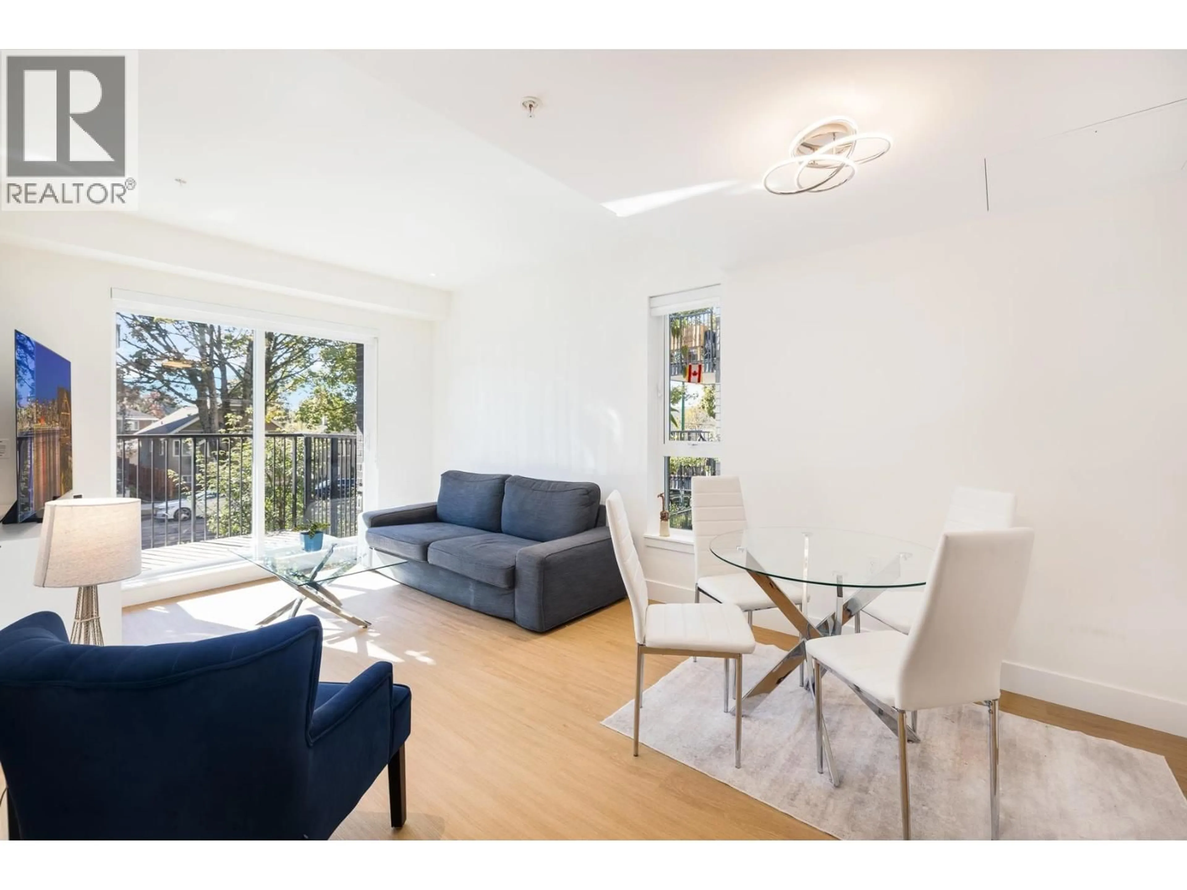 Living room with furniture, wood/laminate floor for 204 - 2235 BROADWAY STREET, Vancouver British Columbia V5N0J5