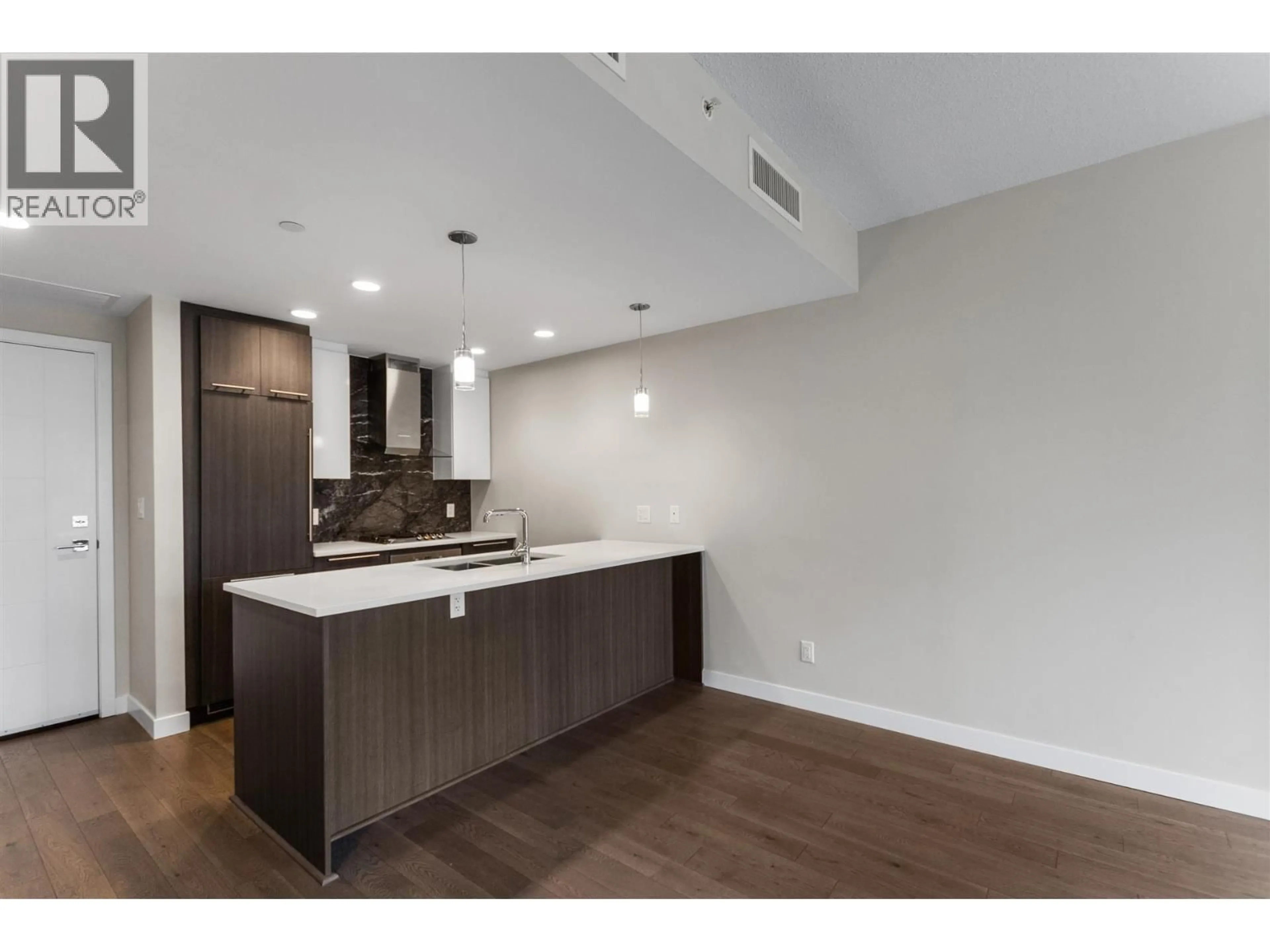 Open concept kitchen, wood/laminate floor for 305 - 4963 CAMBIE STREET, Vancouver British Columbia V5Z0H5
