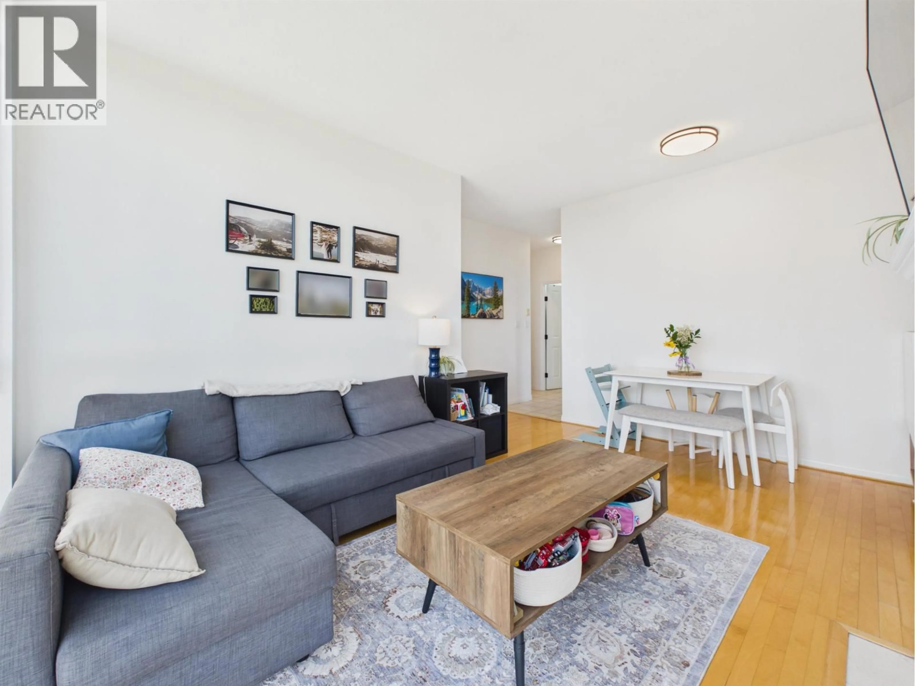 Living room with furniture, wood/laminate floor for 1003 - 6837 STATION HILL DRIVE, Burnaby British Columbia V3N5B7