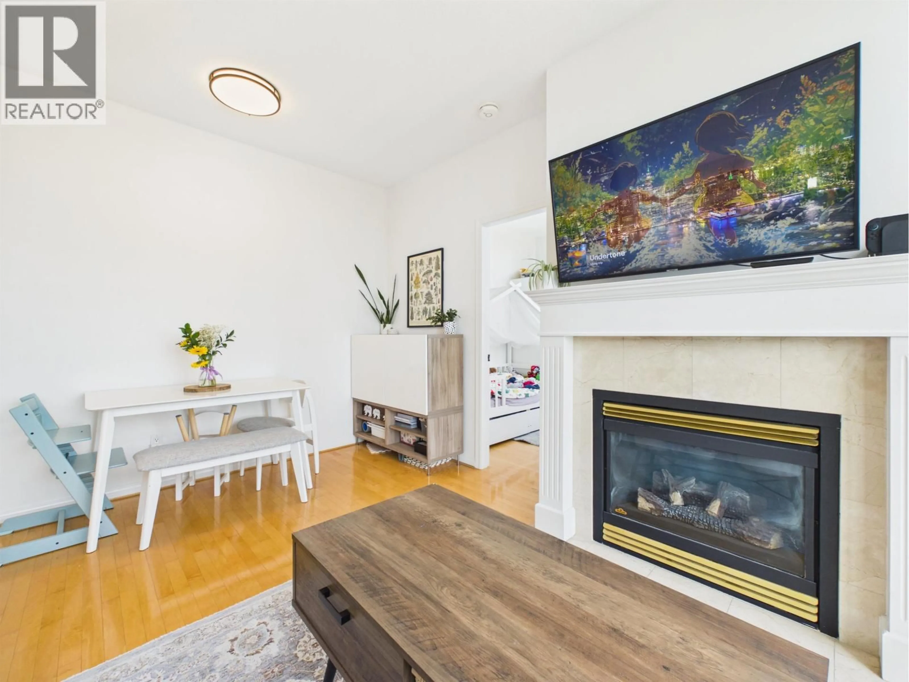 Living room with furniture, wood/laminate floor for 1003 - 6837 STATION HILL DRIVE, Burnaby British Columbia V3N5B7