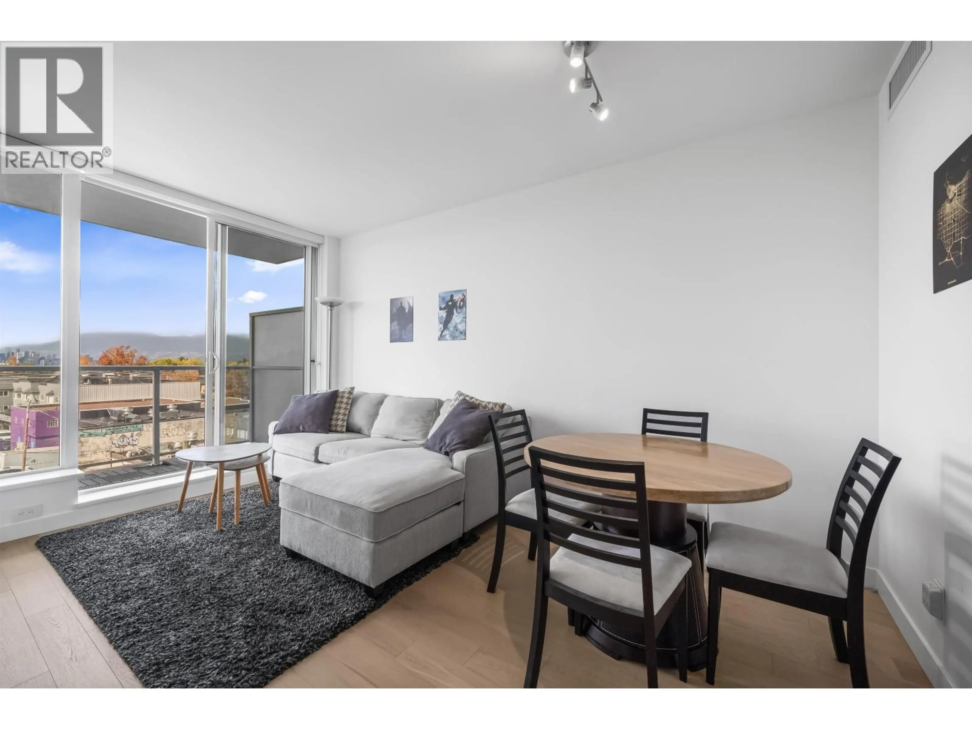 Living room with furniture, wood/laminate floor for 603 - 4638 GLADSTONE STREET, Vancouver British Columbia V5N0G5