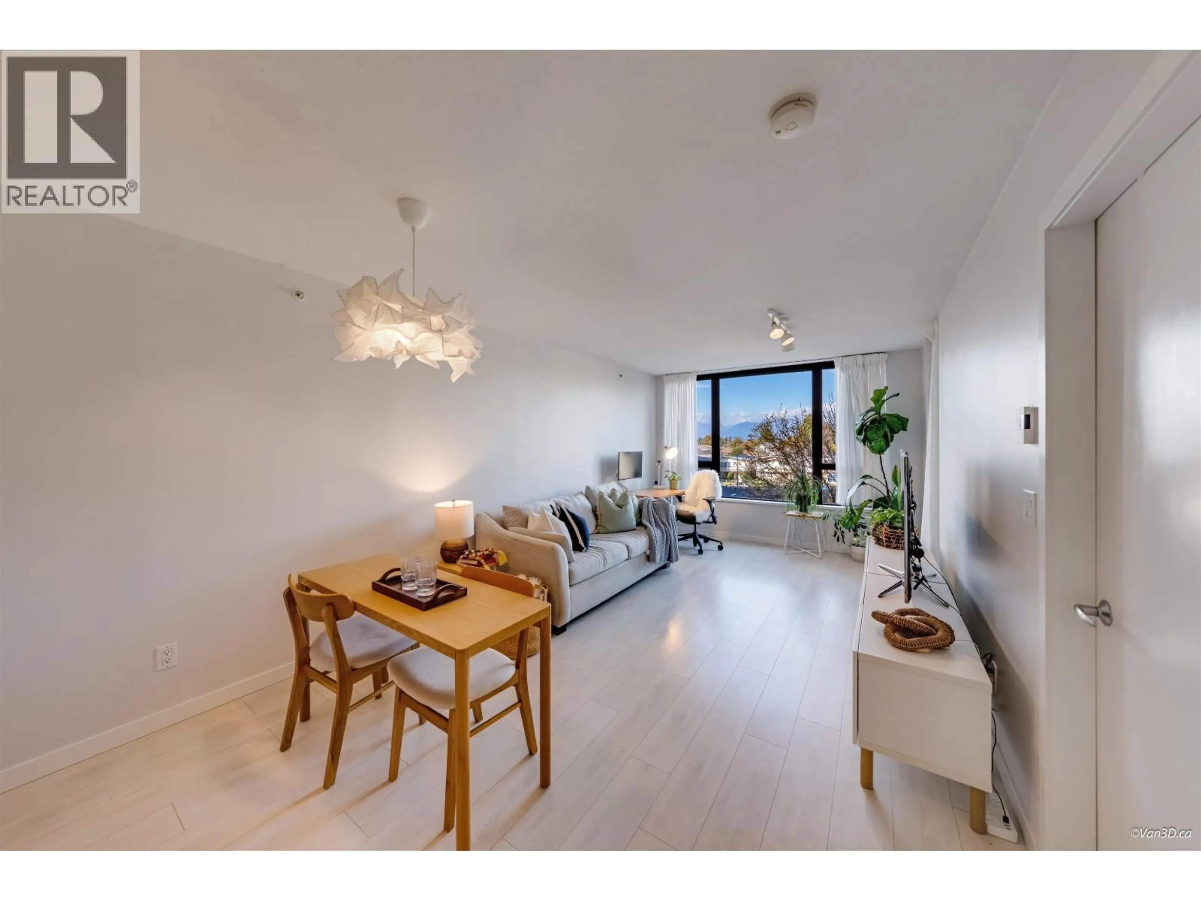 Living room with furniture, wood/laminate floor for 402 - 7138 COLLIER STREET, Burnaby British Columbia V5E0A2