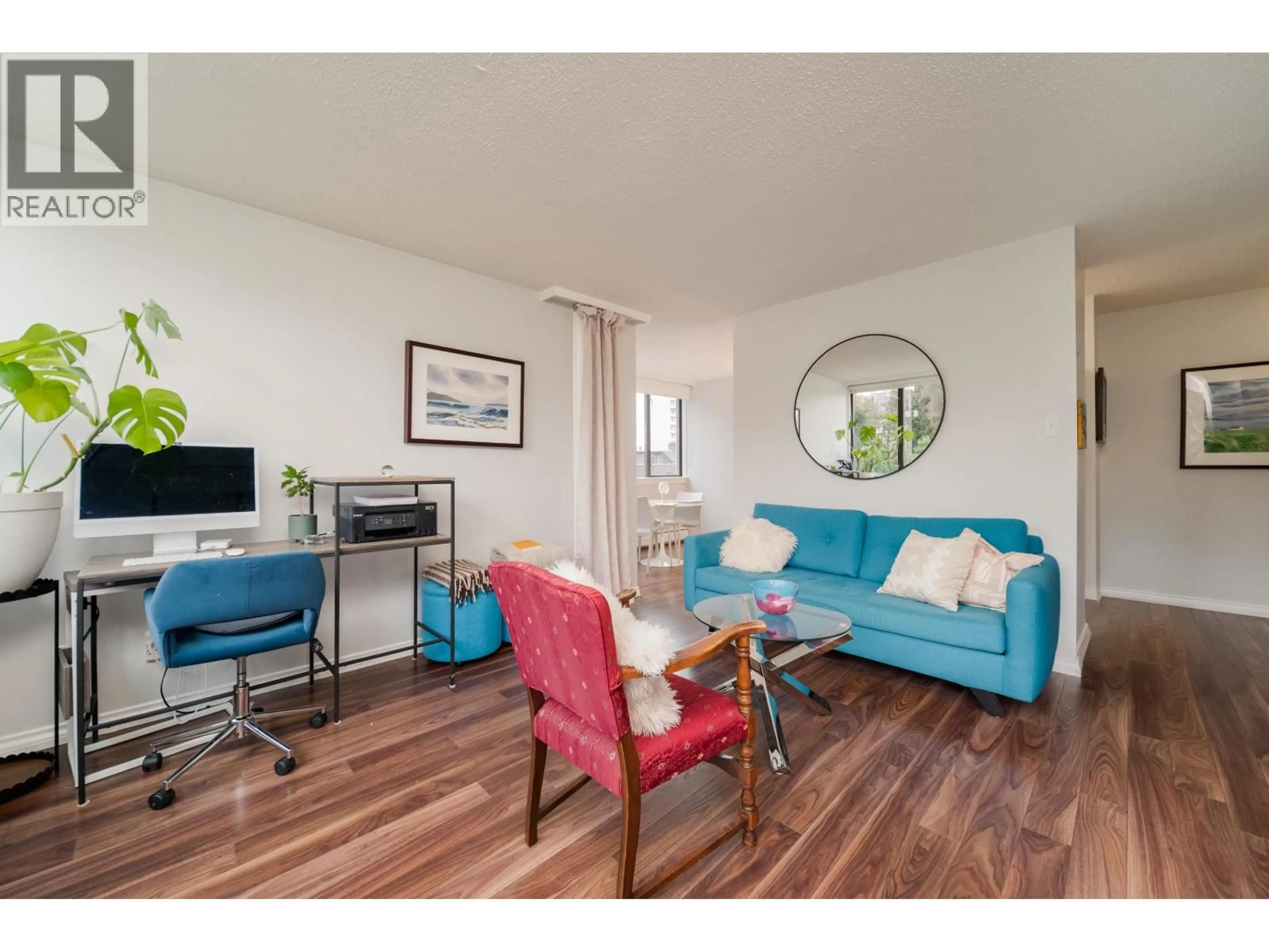 Living room with furniture, wood/laminate floor for 206 - 1740 COMOX STREET, Vancouver British Columbia V6G2Z1