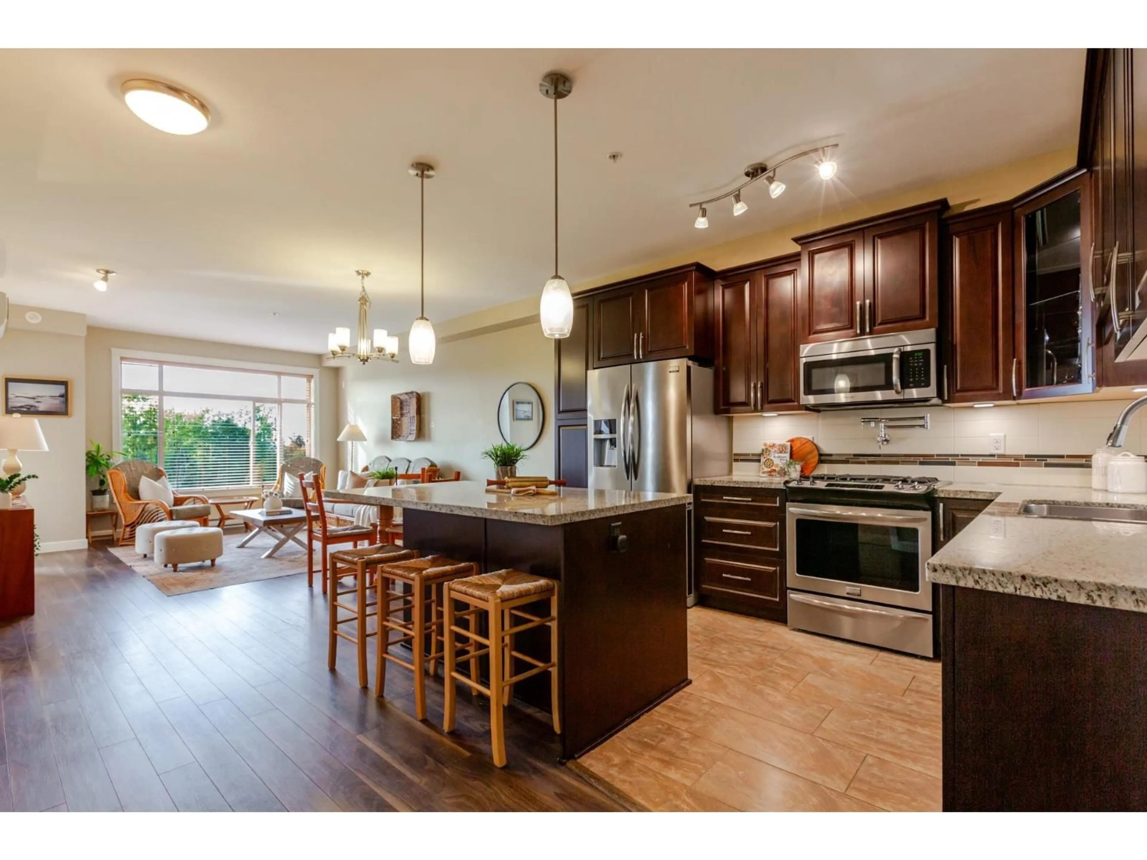 Open concept kitchen, wood/laminate floor for 506 - 8157 207 STREET, Langley British Columbia V2Y0V4