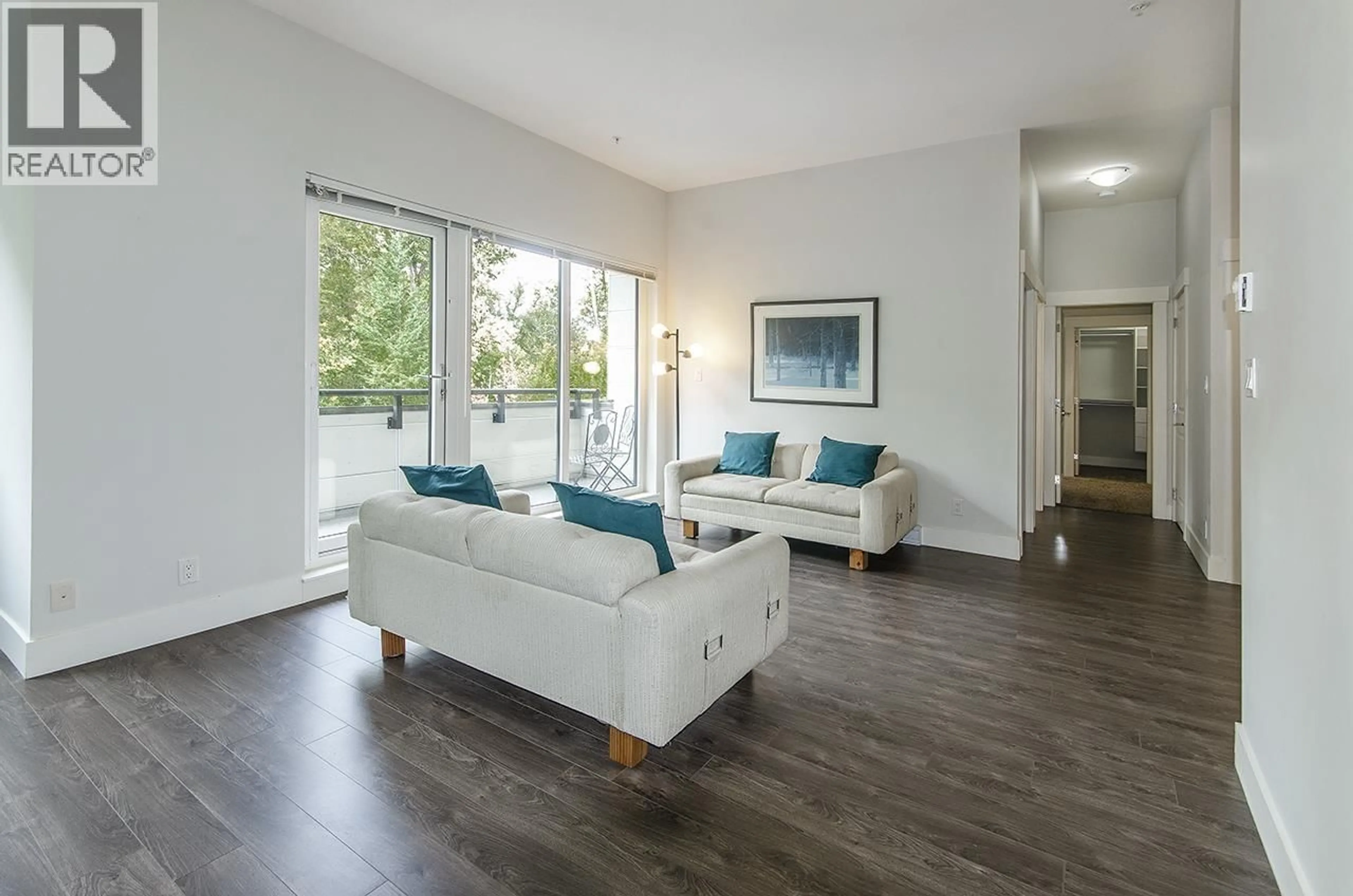 Living room with furniture, wood/laminate floor for 401 - 2362 WHYTE AVENUE, Port Coquitlam British Columbia V3C2A4
