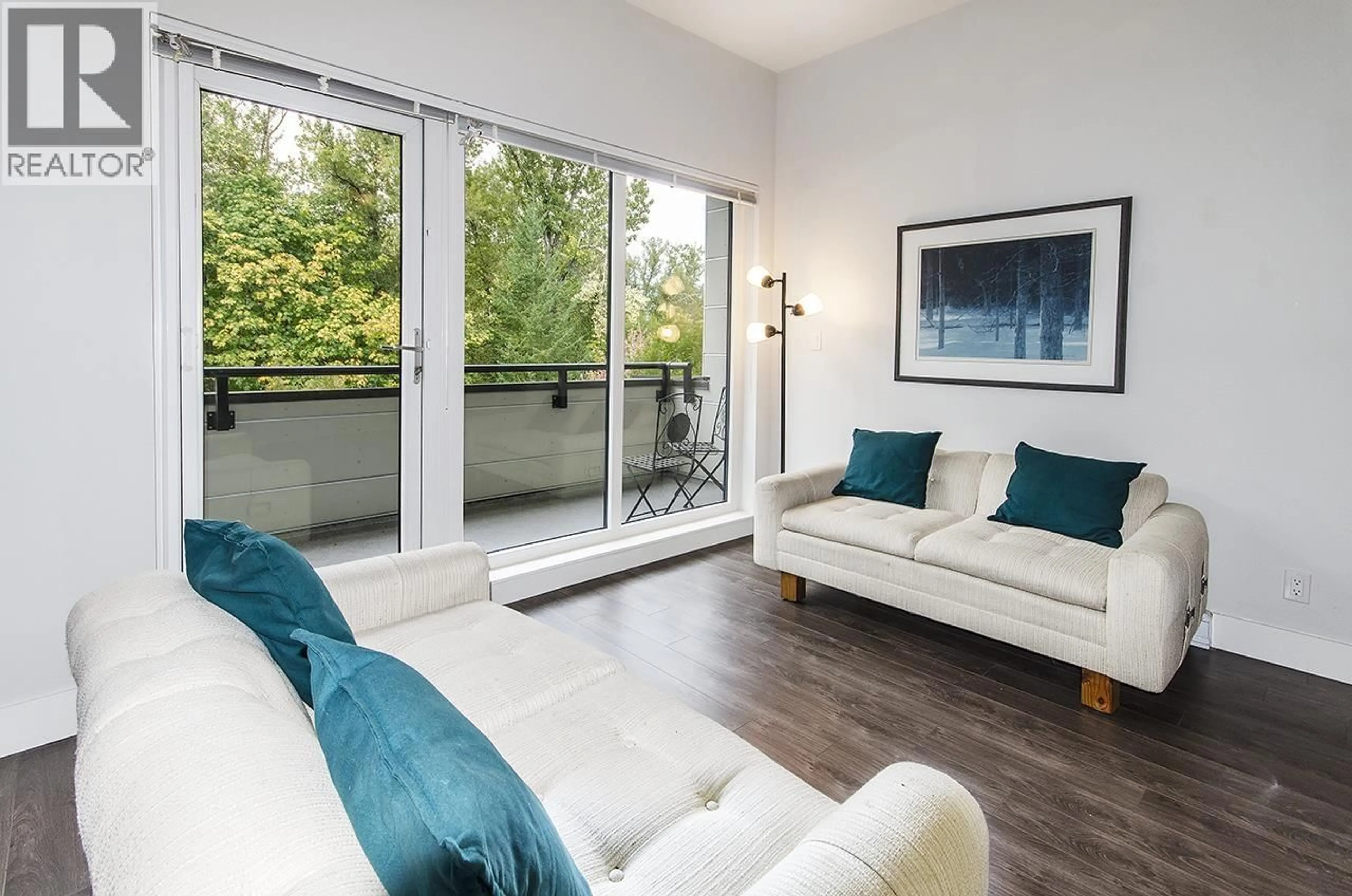 Living room with furniture, wood/laminate floor for 401 - 2362 WHYTE AVENUE, Port Coquitlam British Columbia V3C2A4