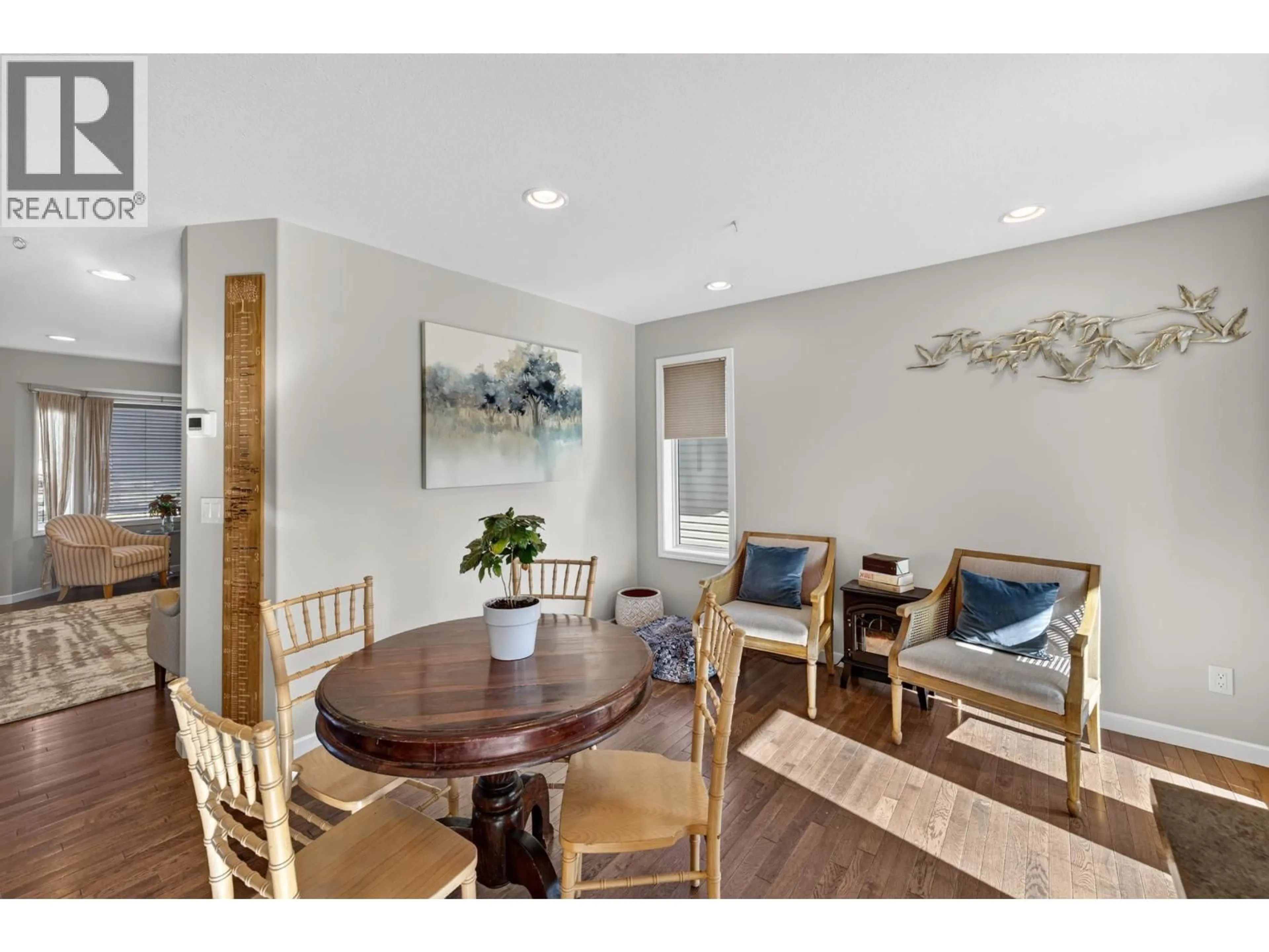 Dining room, wood/laminate floor for 8715 114 AVENUE, Fort St. John British Columbia V1J0C3