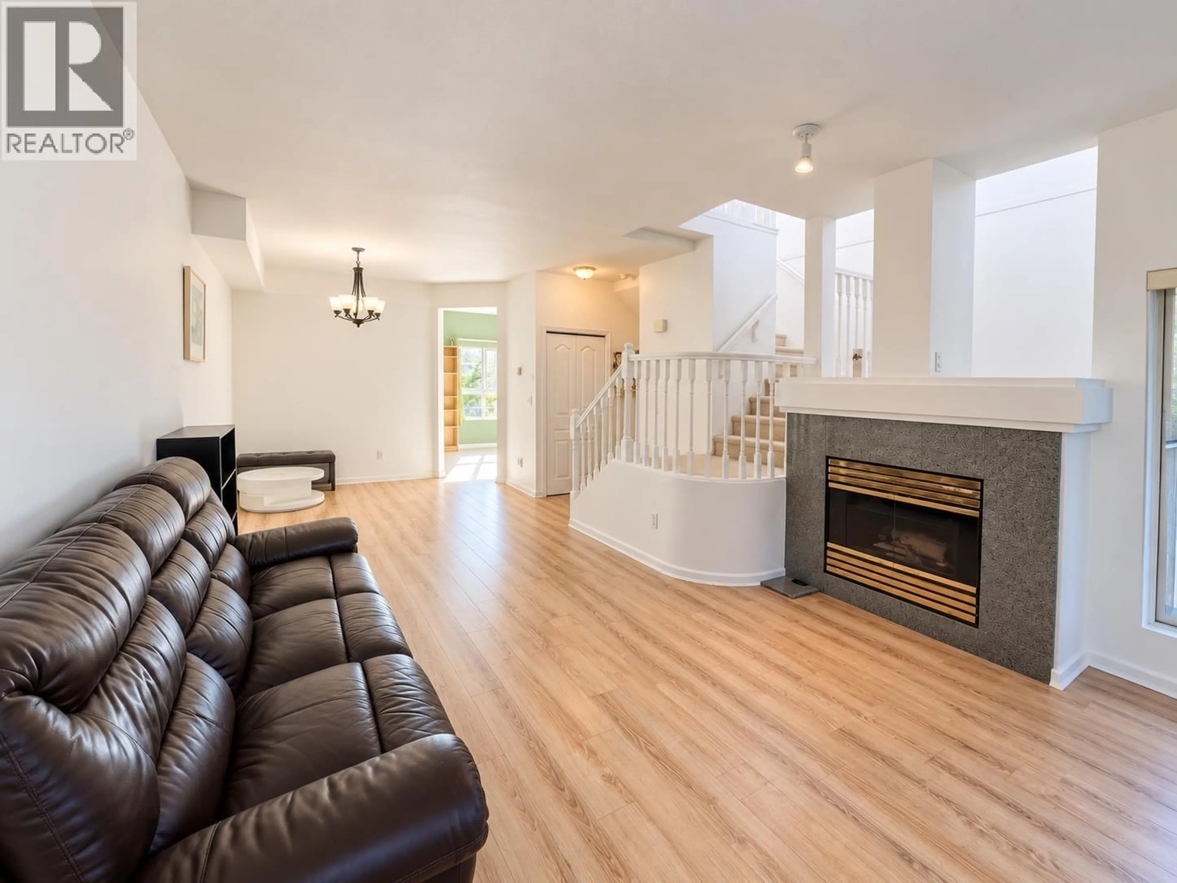 Living room with furniture, wood/laminate floor for 2 - 8300 JONES ROAD, Richmond British Columbia V6Y1L6