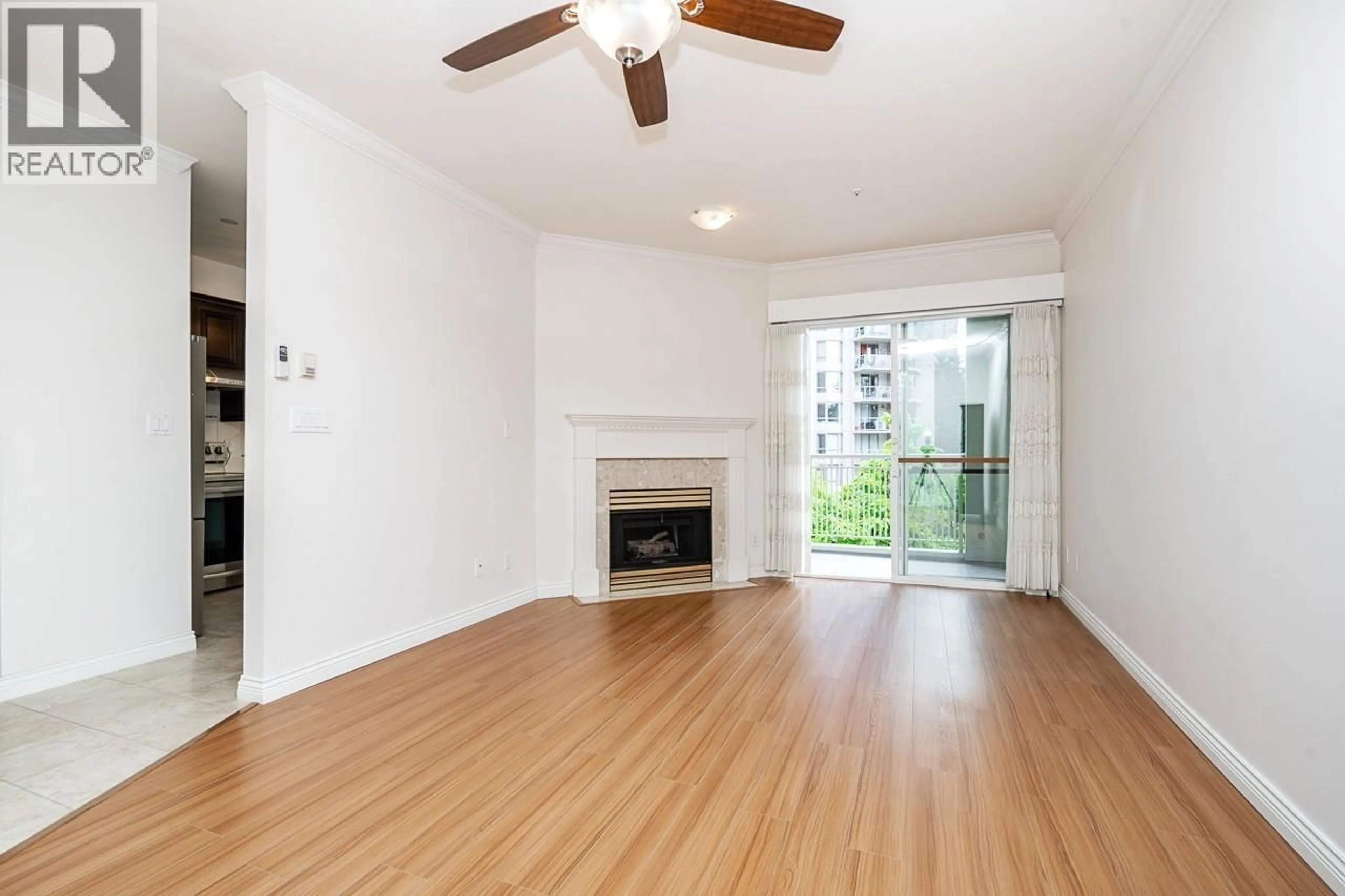 Living room with furniture, wood/laminate floor for 312 - 3098 GUILDFORD WAY, Coquitlam British Columbia V3B7W8