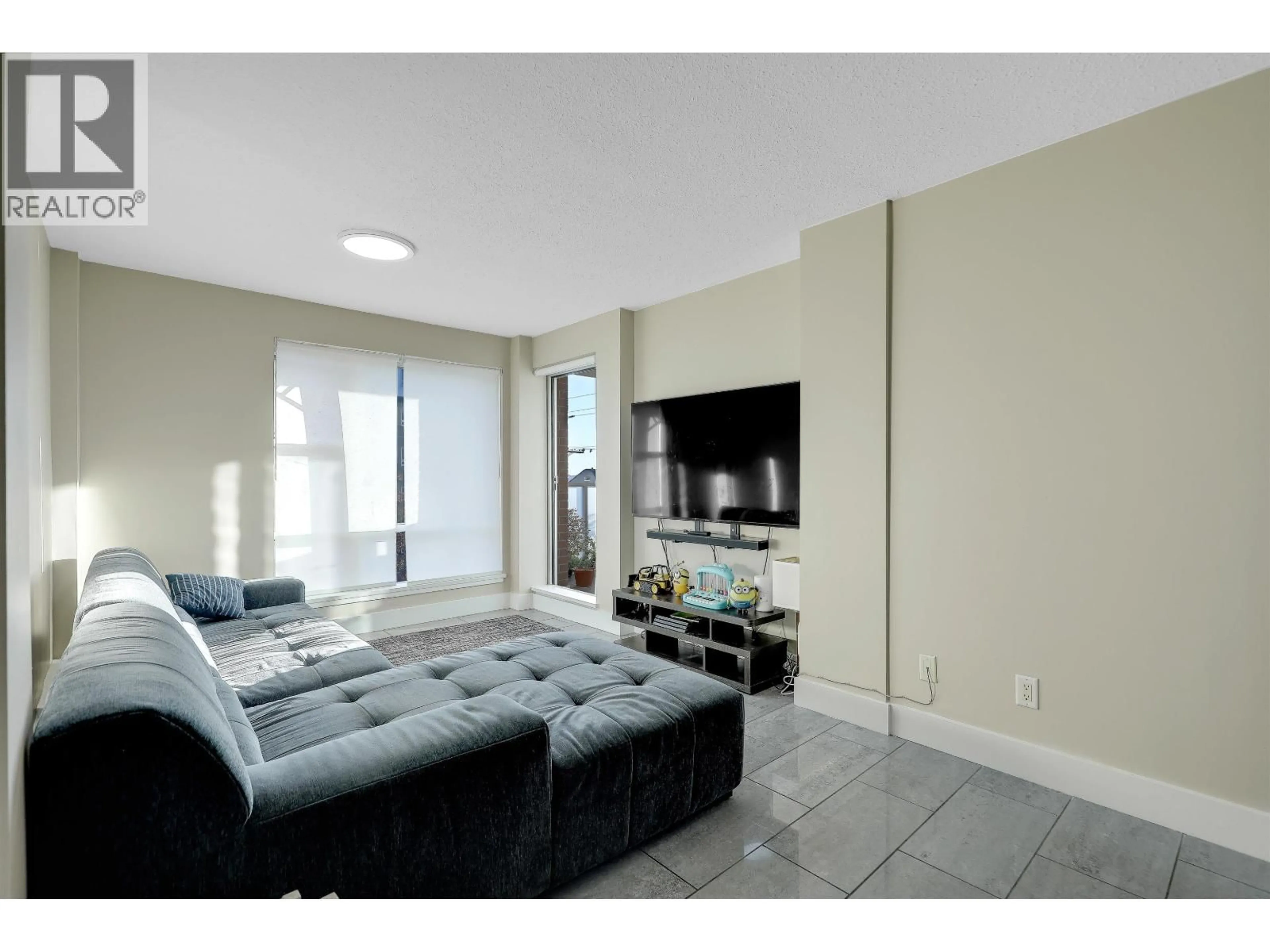Living room with furniture, unknown for 206 - 3811 HASTINGS STREET, Burnaby British Columbia V5C6V2