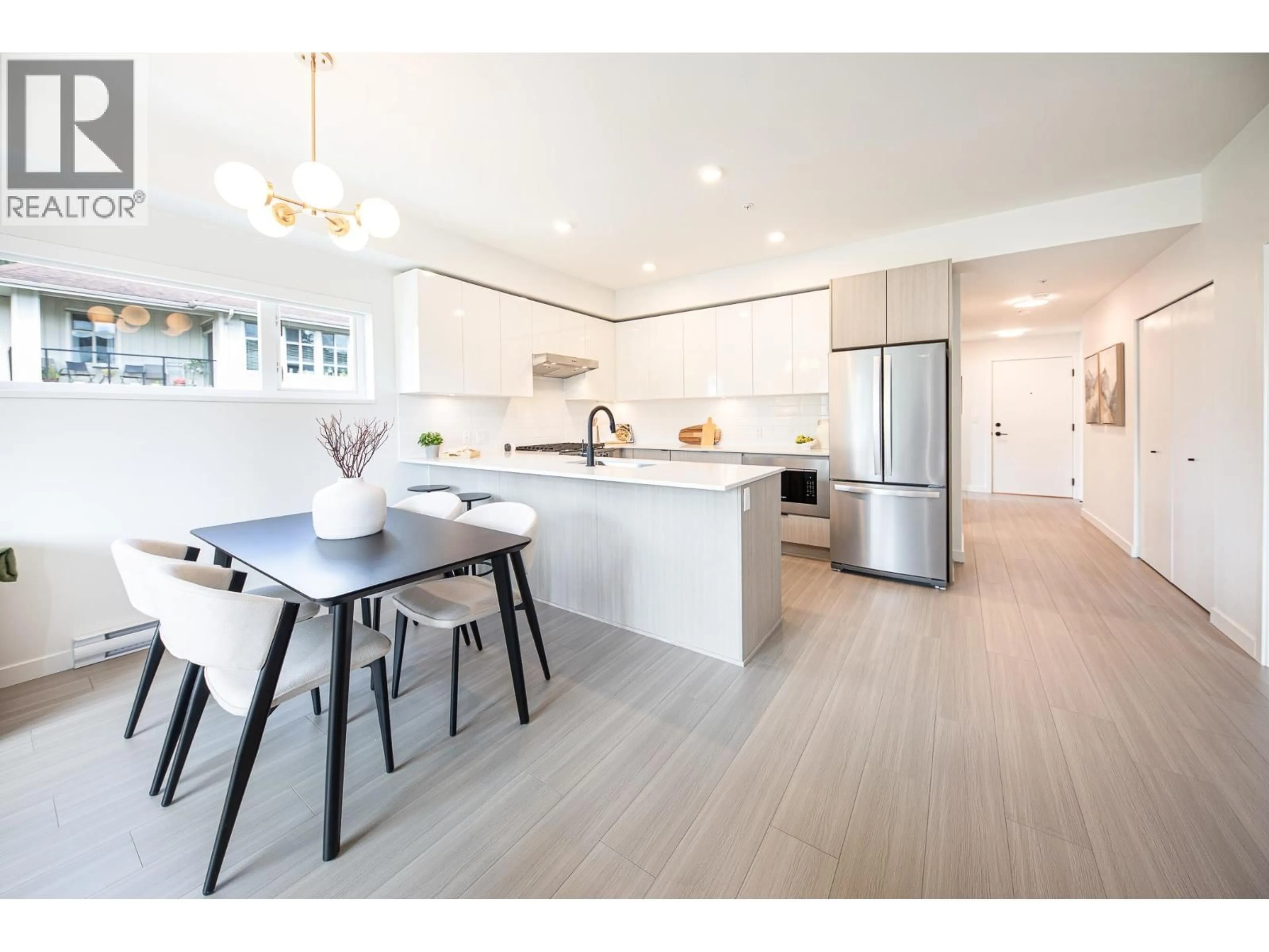 Open concept kitchen, wood/laminate floor for 202 - 2277 HAWTHORNE AVENUE, Port Coquitlam British Columbia V3C1W7