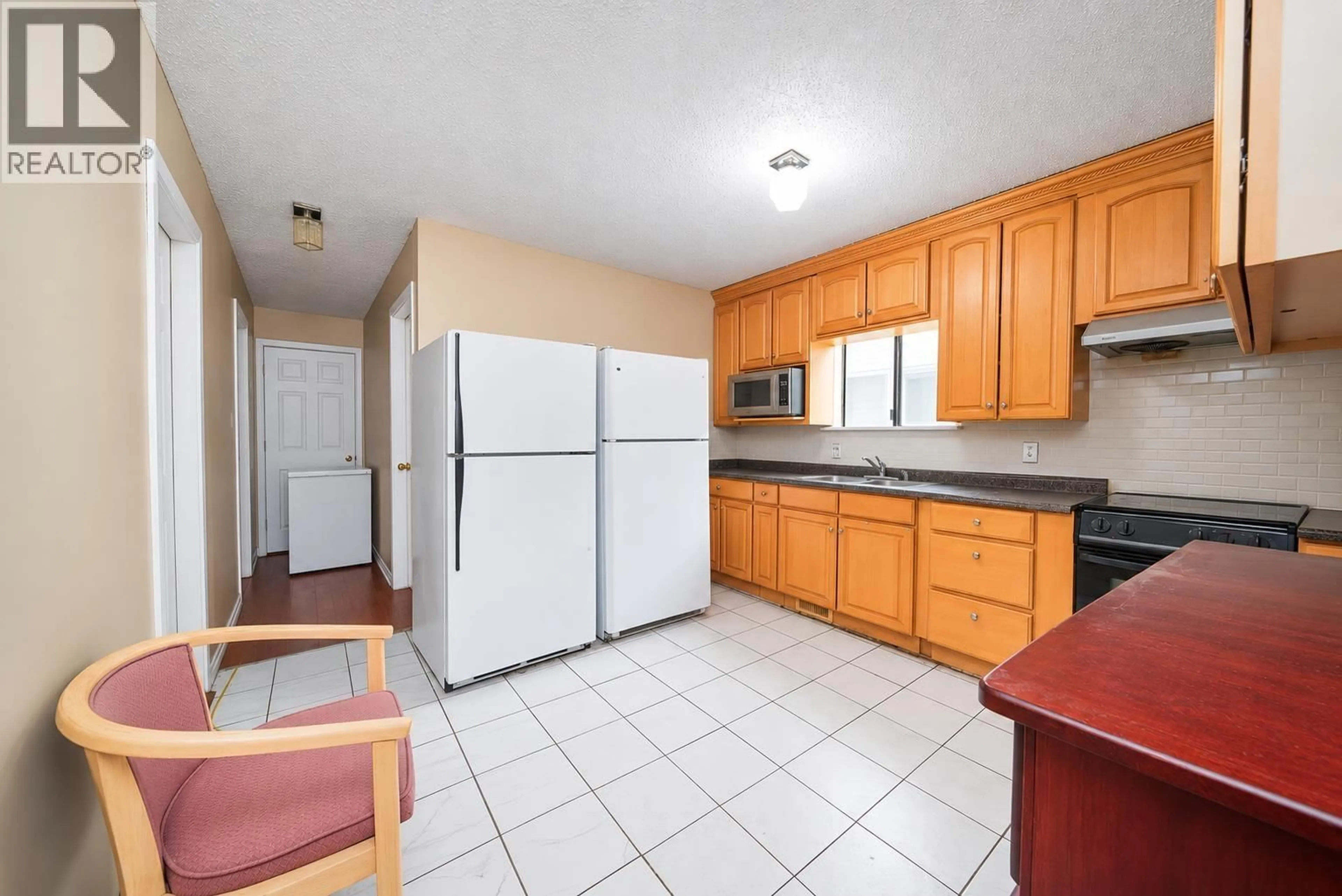 Standard kitchen, ceramic/tile floor for 4940 KILLARNEY STREET, Vancouver British Columbia V5R3V7