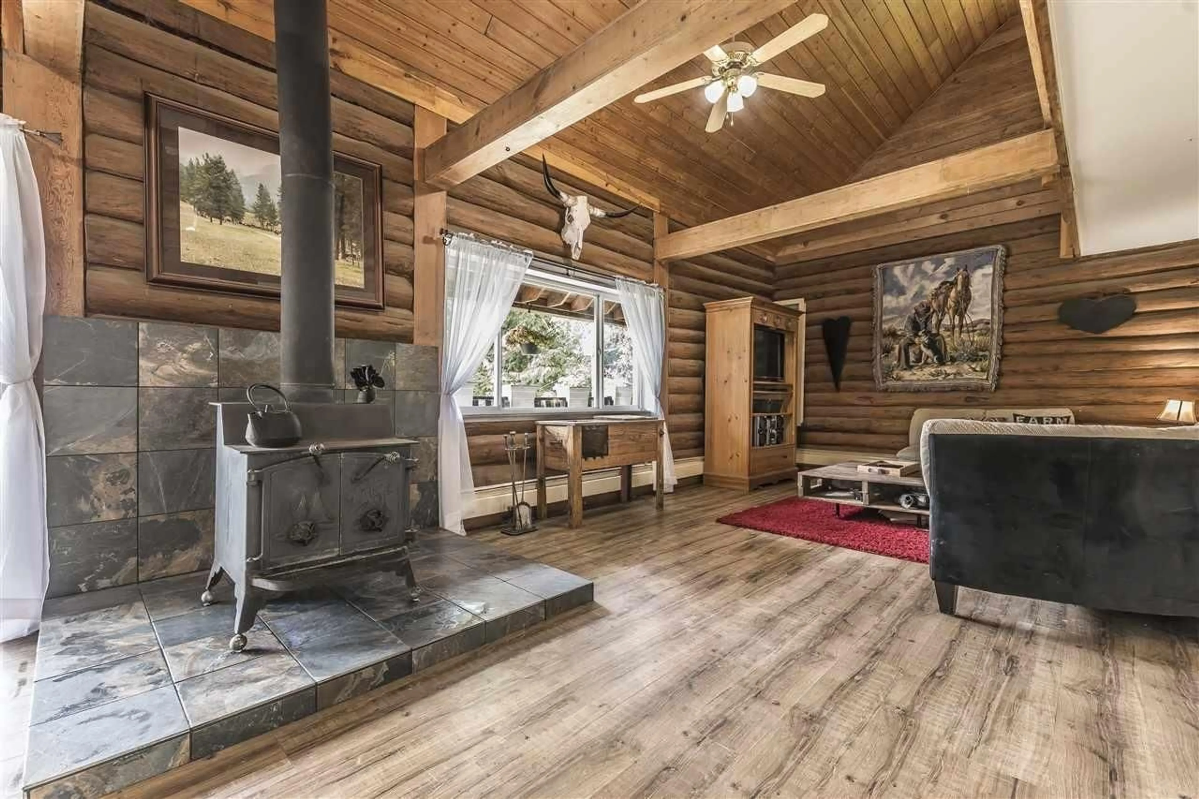 Living room with furniture, wood/laminate floor for 50235 LOOKOUT ROAD, Ryder Lake British Columbia V4Z1A5