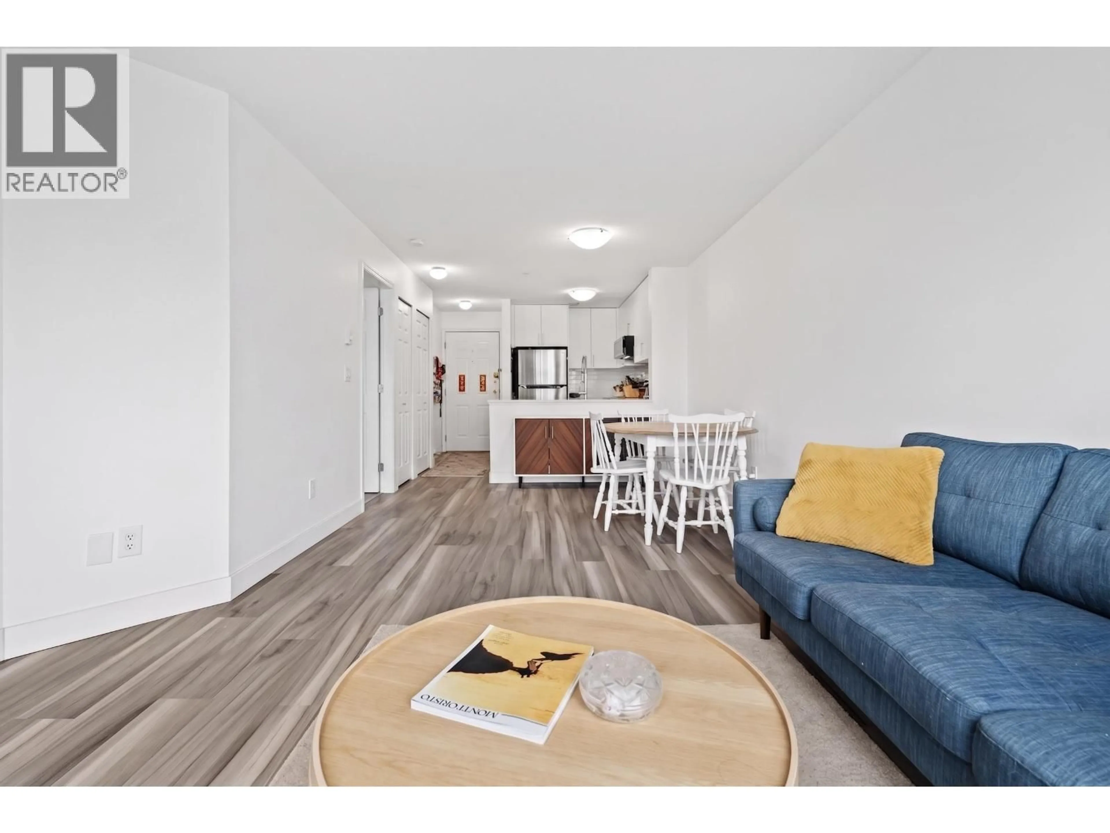 Living room with furniture, wood/laminate floor for 302 - 5818 LINCOLN STREET, Vancouver British Columbia V5R4P7